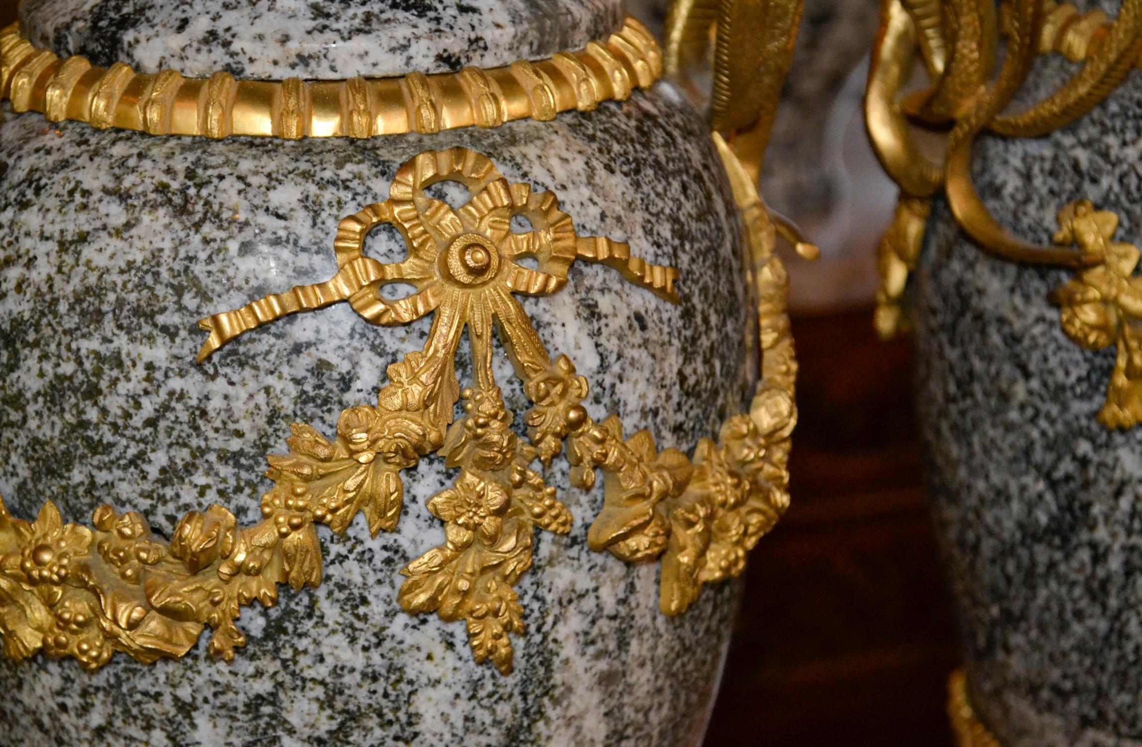 Fine pair of French marble and gilt bronze urns.
