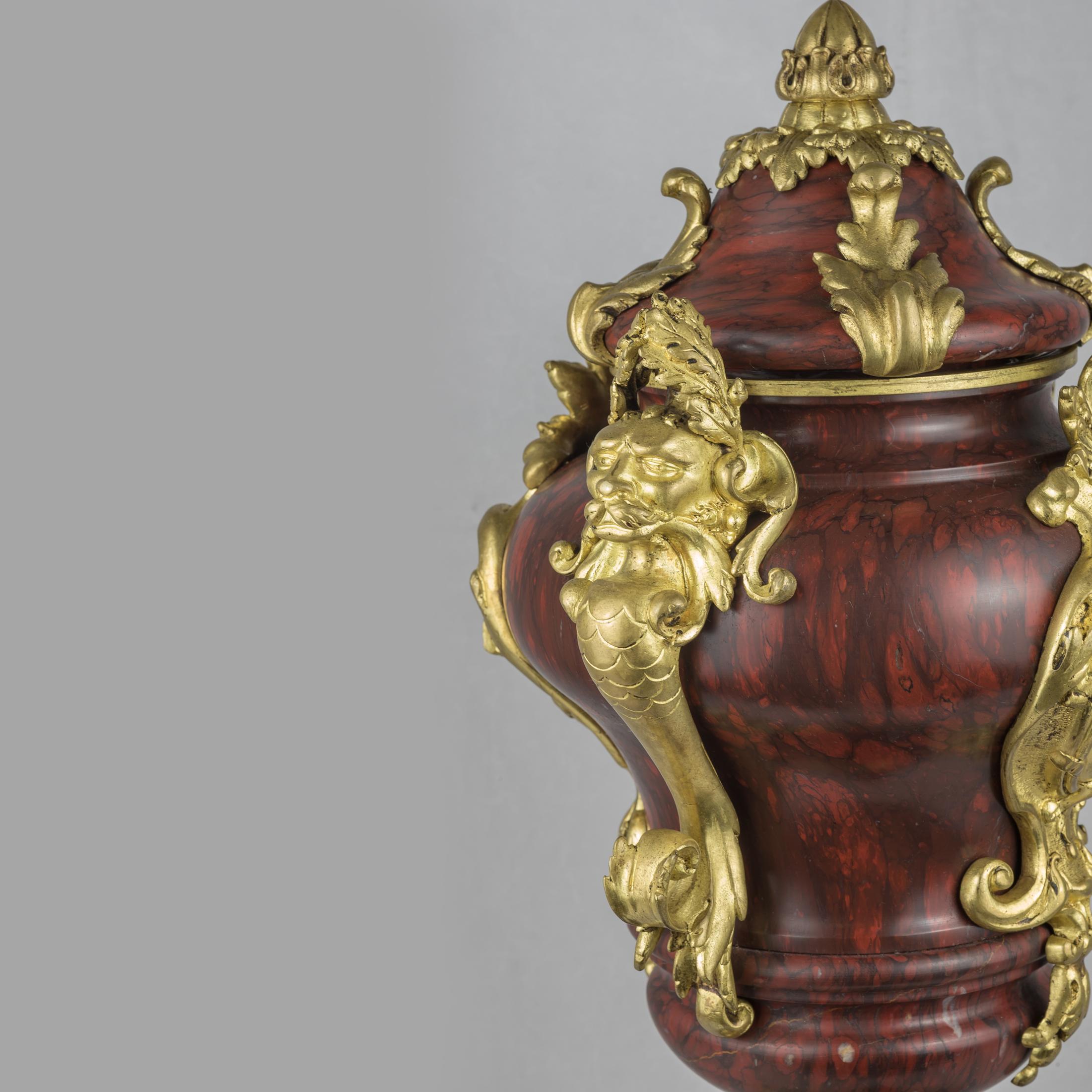 Gilt 19th Century Pair of French Ormolu-Mounted Rouge Marble Urns and Covers For Sale