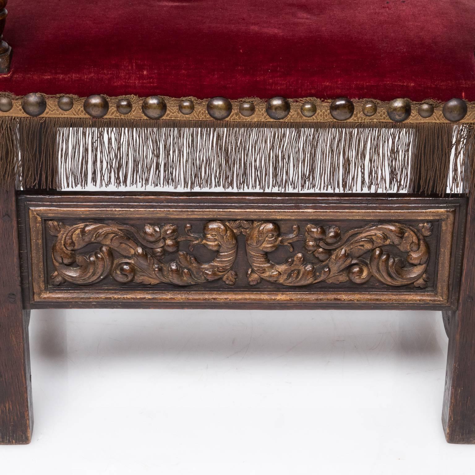 Pair of carved 19th century French Renaissance armchairs with velvet upholstery-upholstery has silk embroidered crests-these amazing chair are made of oak and are nicely carved they have an H stretcher below and a front panel carving they also have