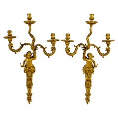 Siglo XIX, Pareja de candelabros franceses de tres luces en bronce dorado