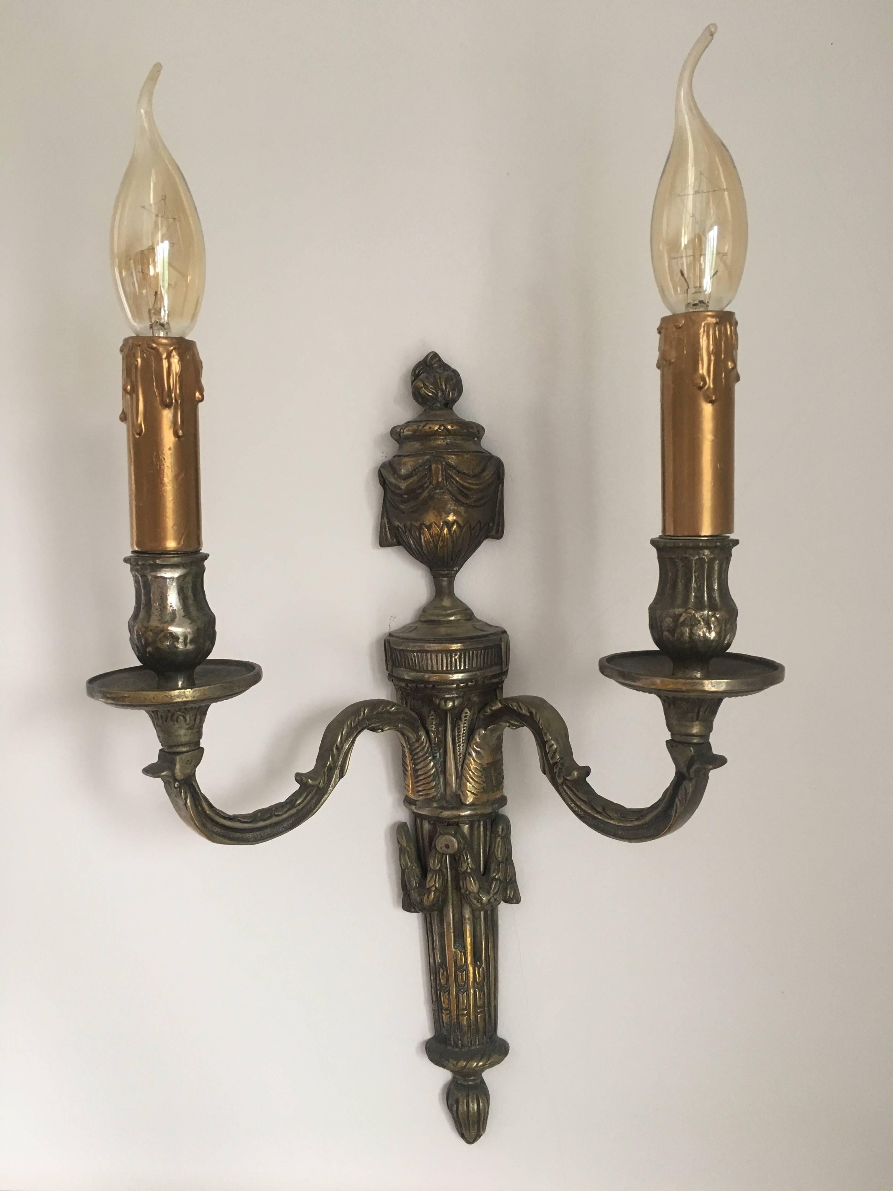 A very fine pair of Louis XV style bronze two-light wall sconces, with their original finish and patina. 
France, circa 1880
 