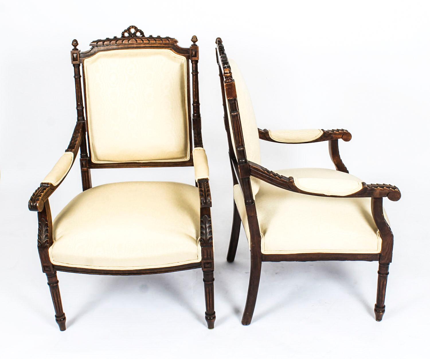 This is a beautiful and comfortable pair of antique French armchairs, circa 1880 in date.

They have been exquisitely hand carved in classical style with padded back supports, acanthus carved arms and elegant fluted forelegs, and they have just
