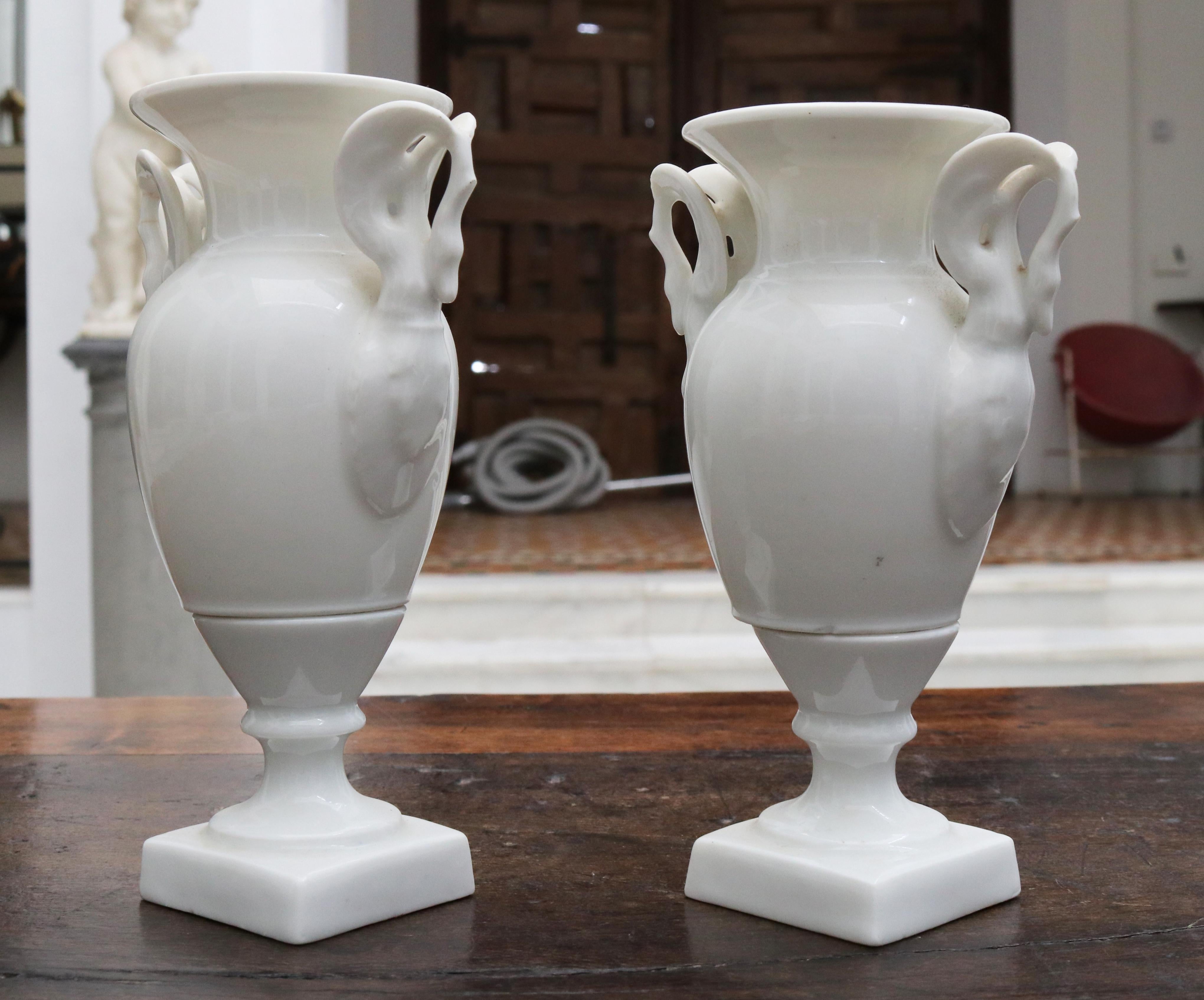 19th century pair of French white porcelain vases with swam shaped handles.