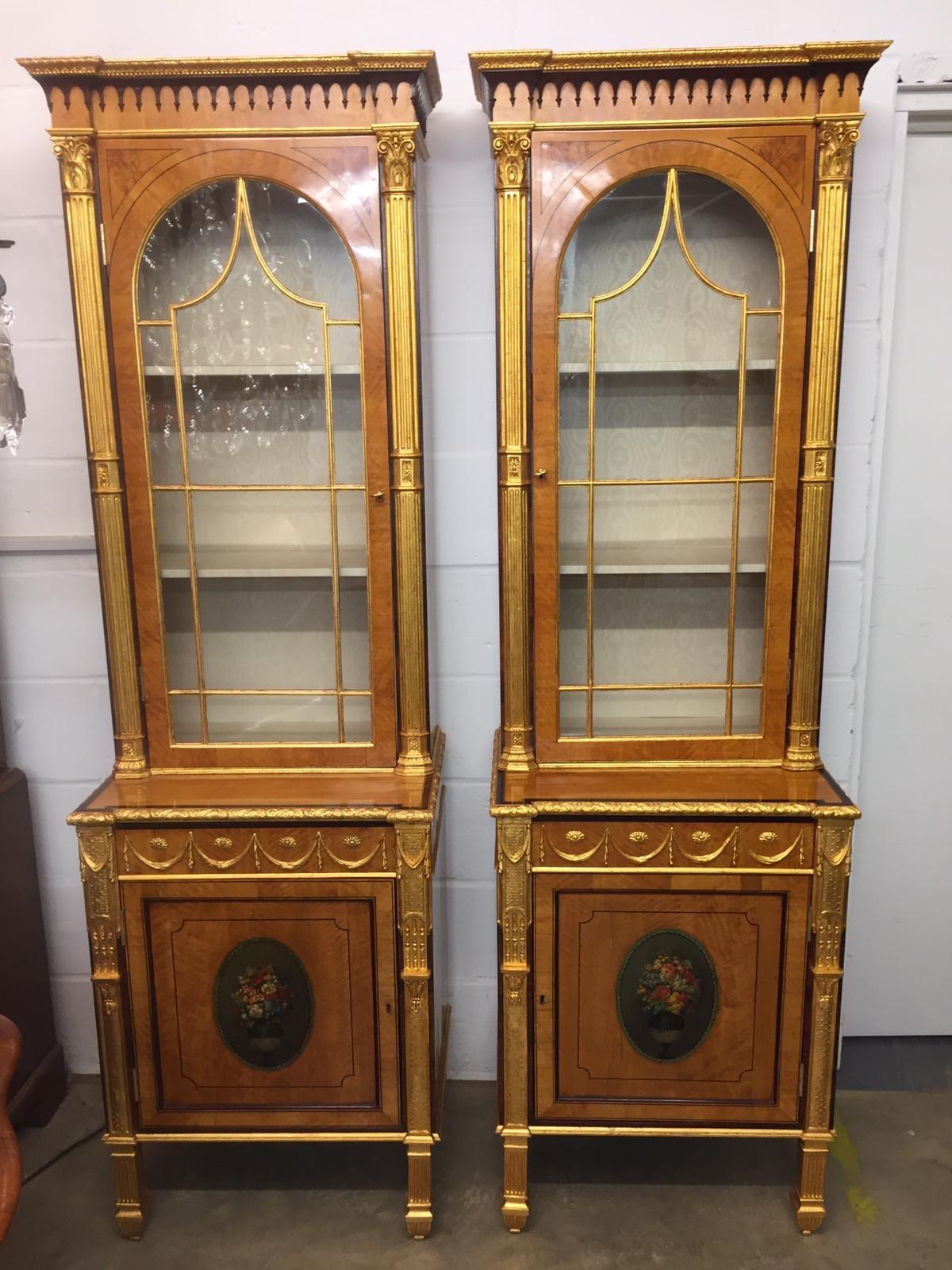A pair of George III period cabinet, circa 1790s, in satinwood and decorated with painted oval of vases of flowers, gilt pilasters ...fantastic, very rare and beautiful. 
Who want a unique cabinet? Here they are!