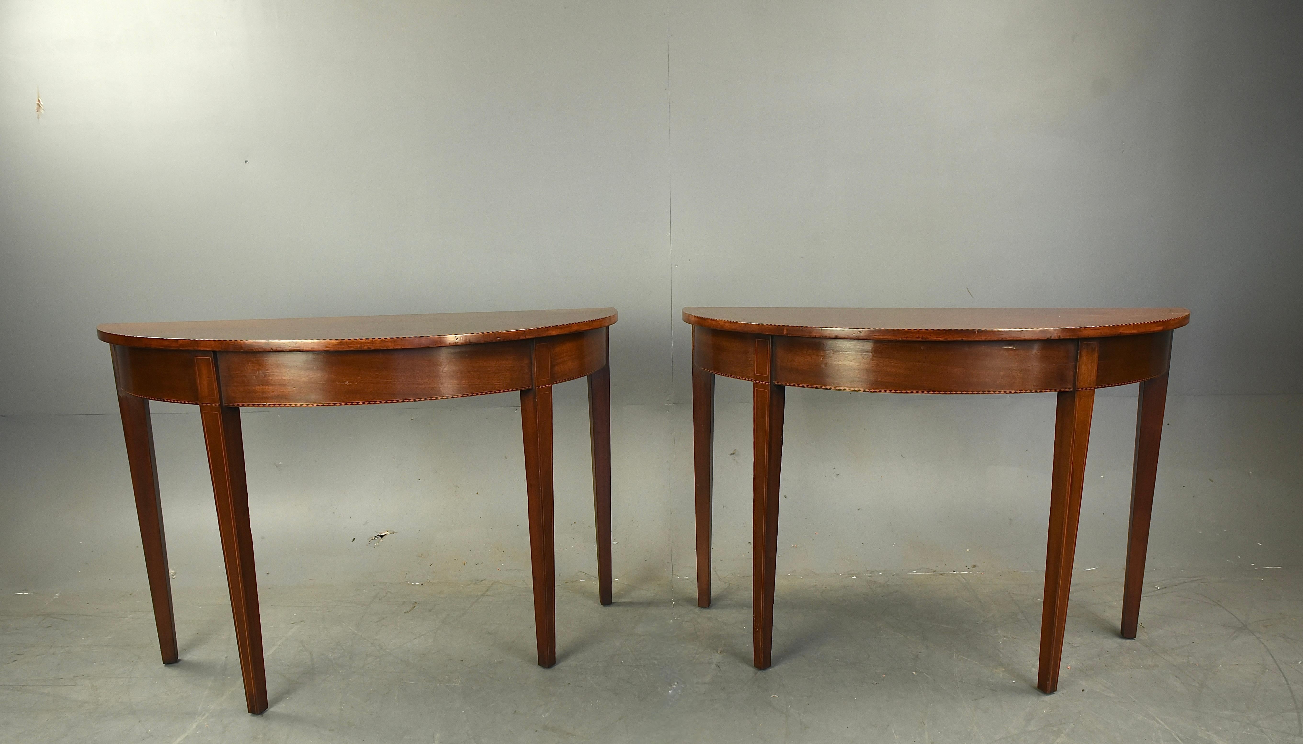 Good quality pair of Georgian mahogany console tables 
They are constructed of solid Mahogany through out with an unusual chequered inlay edging ,they stand four very elegant  line inlaid legs , 
The tables are in very good condition with no damage