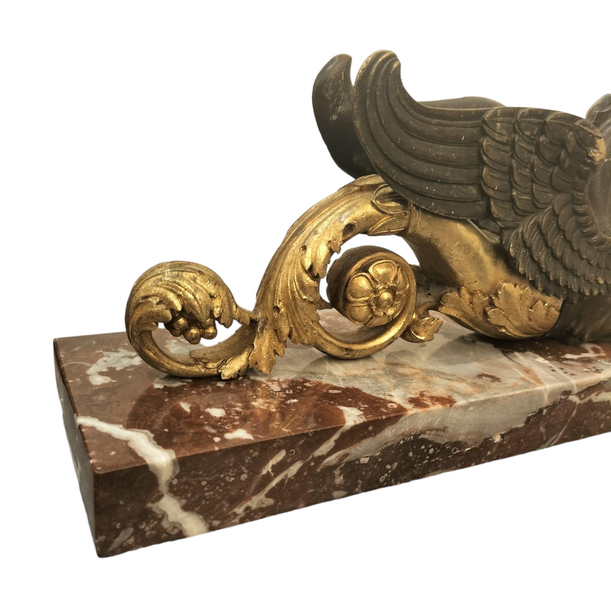 Gilt 19th Century Pair of Gilded Bronze Gryphon Statuettes Mounted on Marble For Sale
