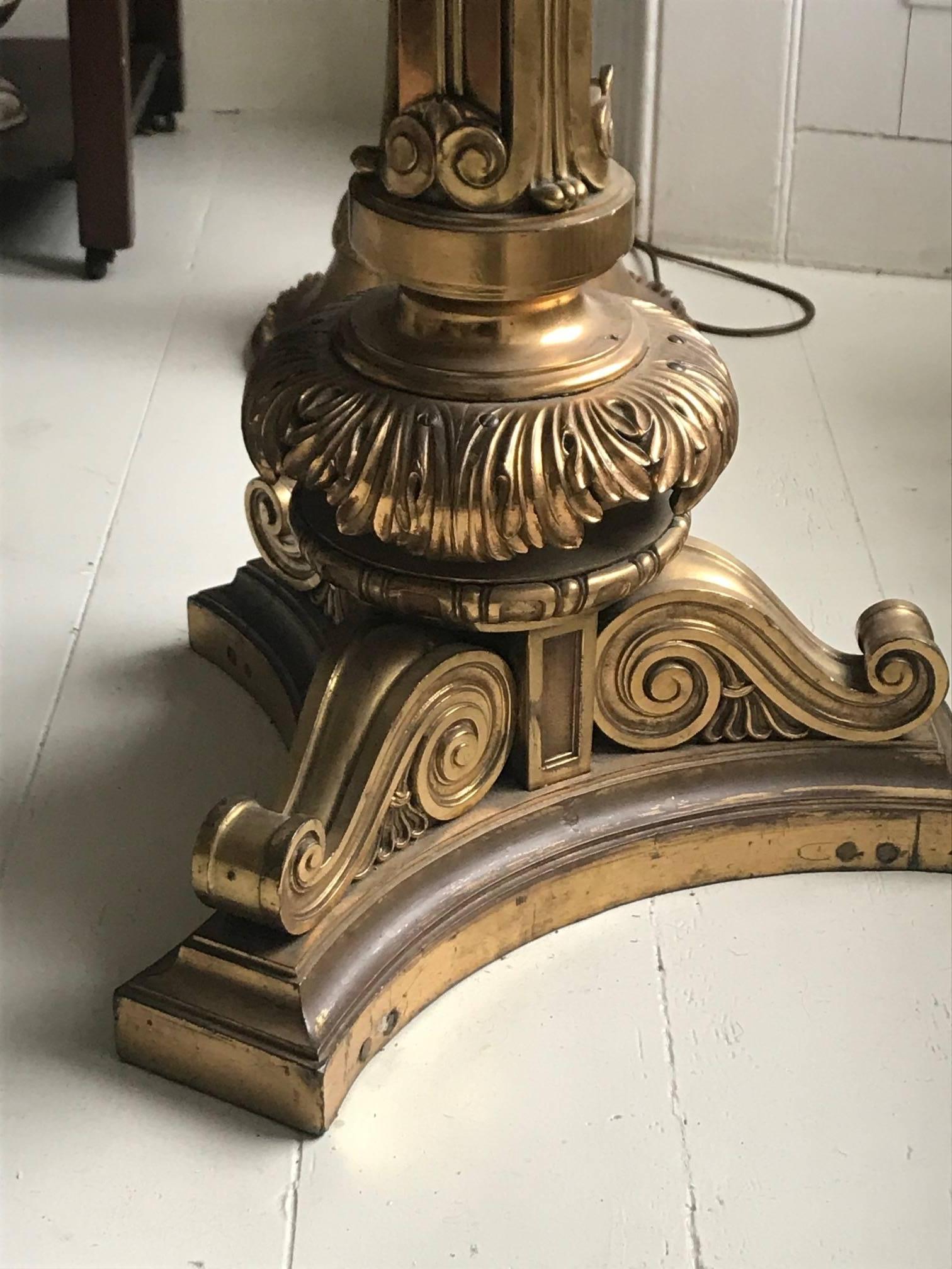 Pair of beautiful late 19th-early 20th century gilt bronze centre tables with ornately cast columns and scrolled triform bases. Each with an octagonal inlaid pietre dure marble tops. Pietre dure, is a term for the inlay technique of using cut and