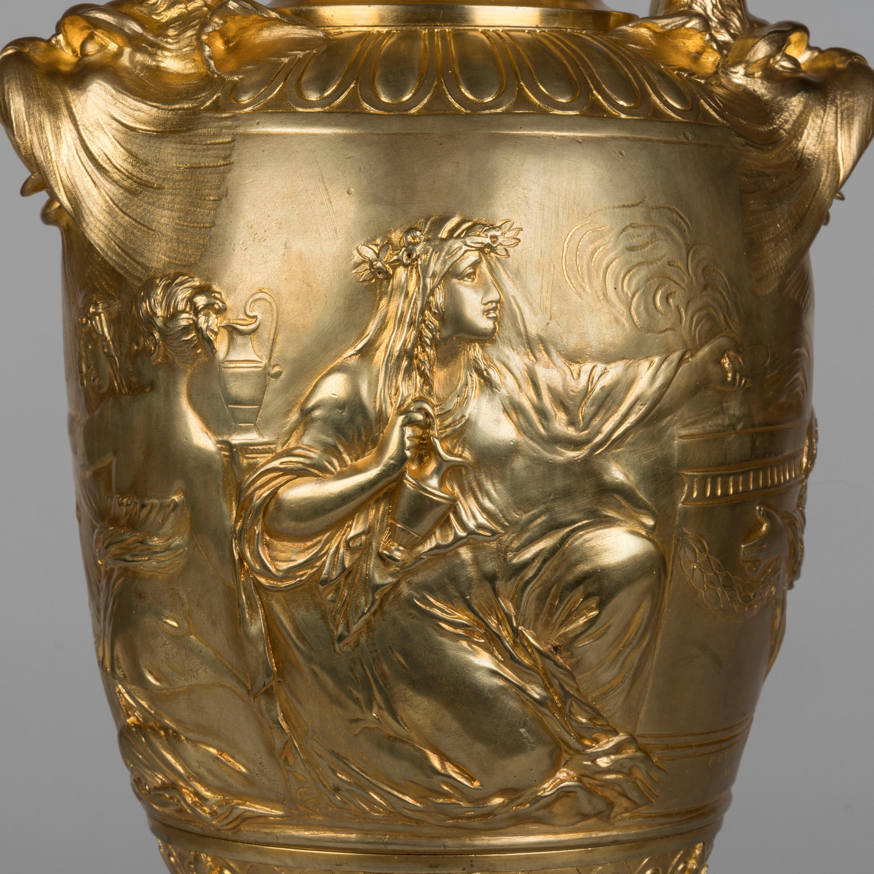 A Pair of bronze Vases
Depicting the 'Sacrifice to Venus'

Designed by Clodion
Cast by Barbedienne

Constructed from cast and hand-chased gilded bronze and supported on Griotte Rouge marble bases, the twin-handled vases in the Neoclassical