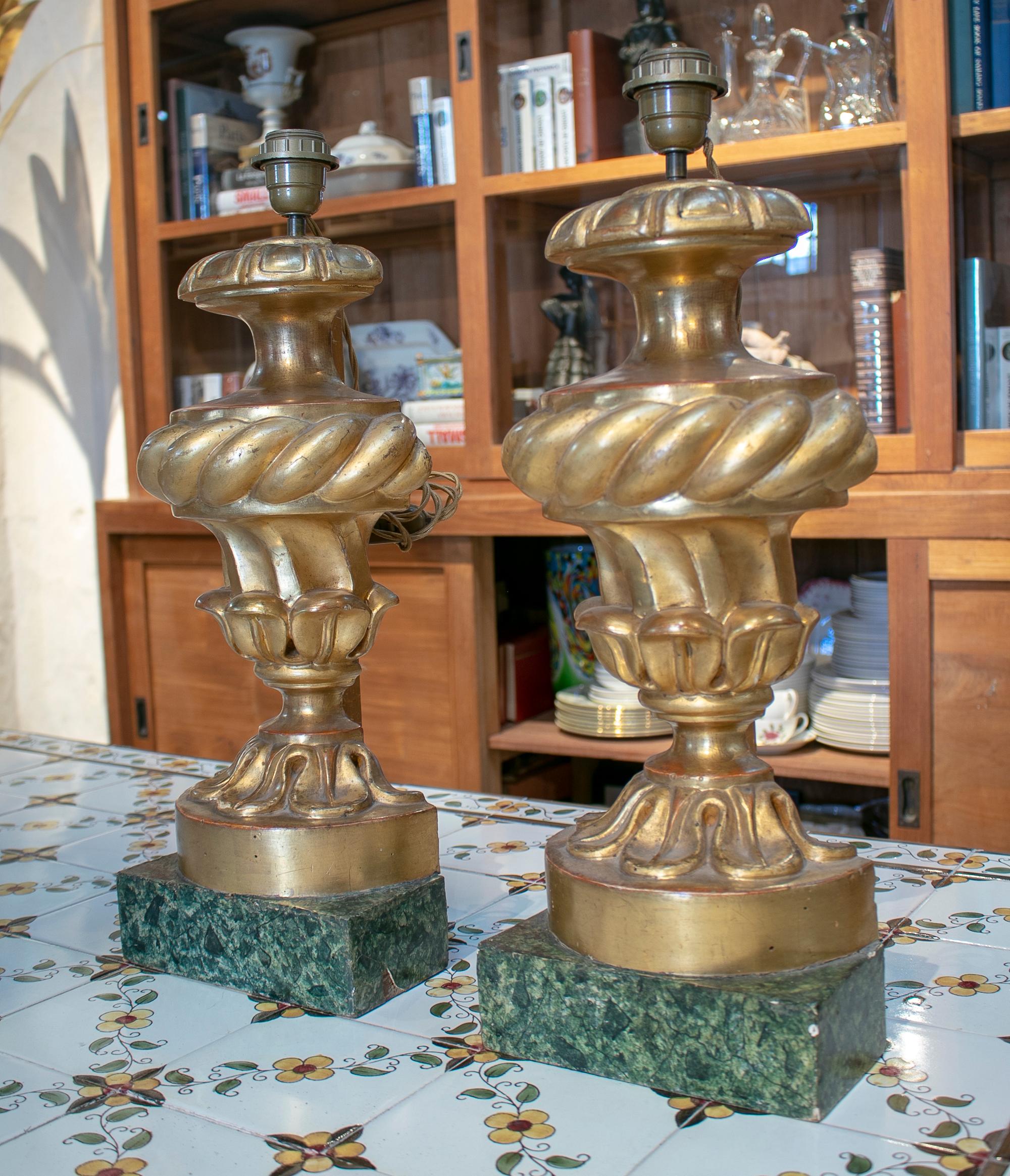 19th century pair of gold gilt wooden table lamps with marbled base.