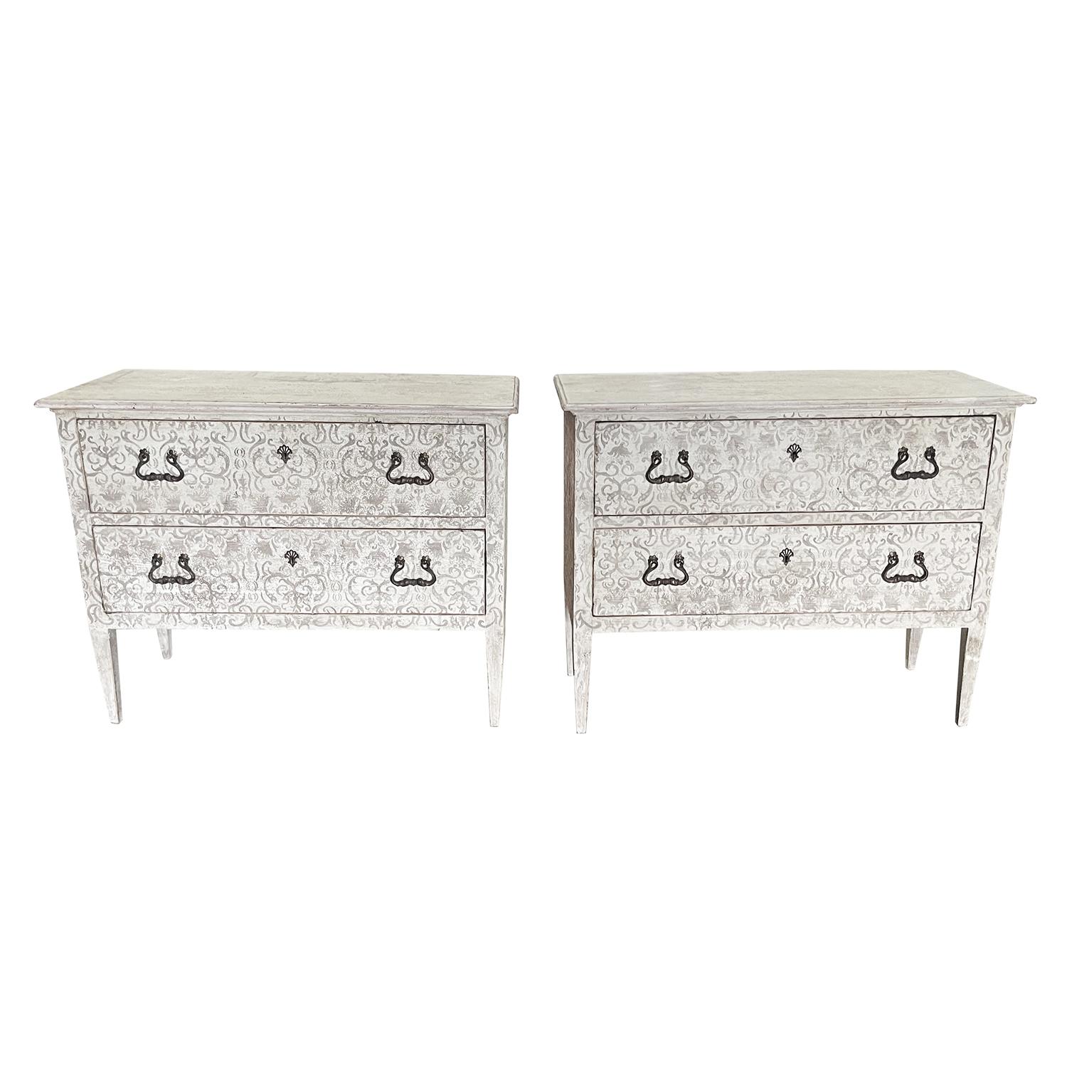 A late 19th Century, antique Italian pair of large bed side tables, nightstands in the Arte Povera technique, made of hand crafted painted Pinewood, in good condition. The Tuscan cabinets are composed with two drawers, embellished by arched door