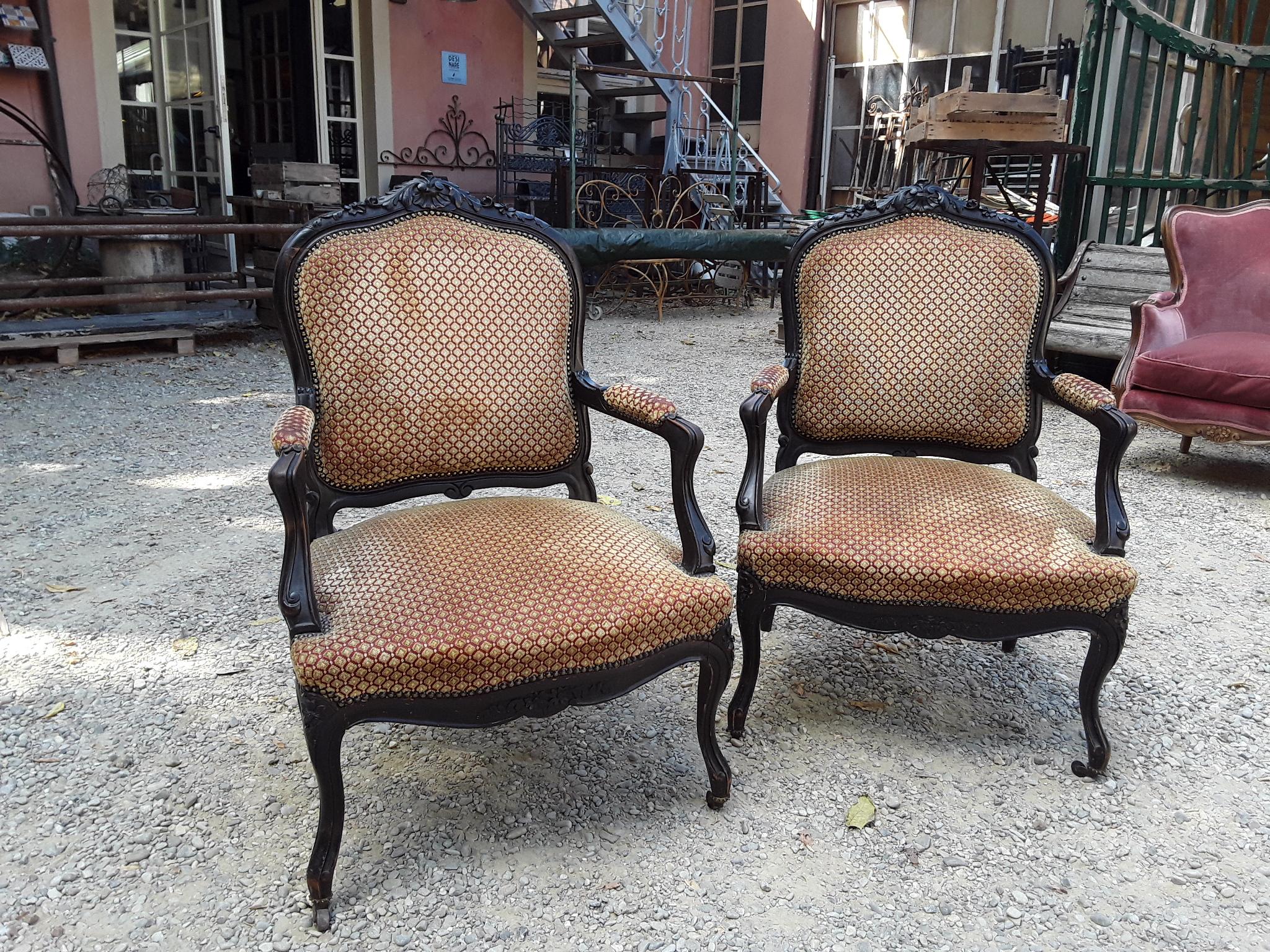 19th century pair of Italian ebonized wood armchairs with original fabric. 1890s.