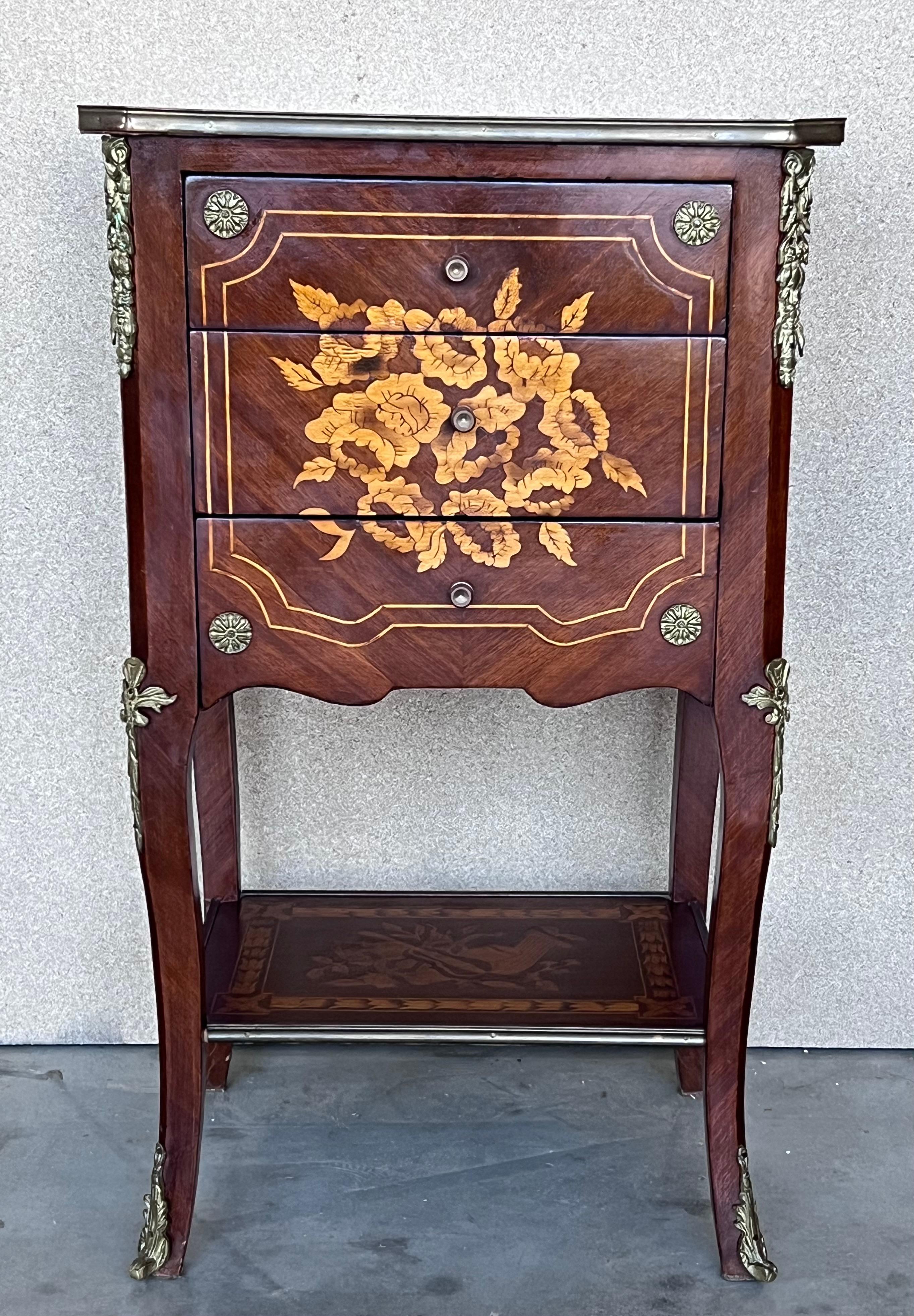 A very fine Louis XV Italian side tables or nightstands with elegant marquetry work, all original unrestored. This sumptuous side tables have a distinctively shaped rectangular marquetry top with an attractive bronze mounted border. The body is