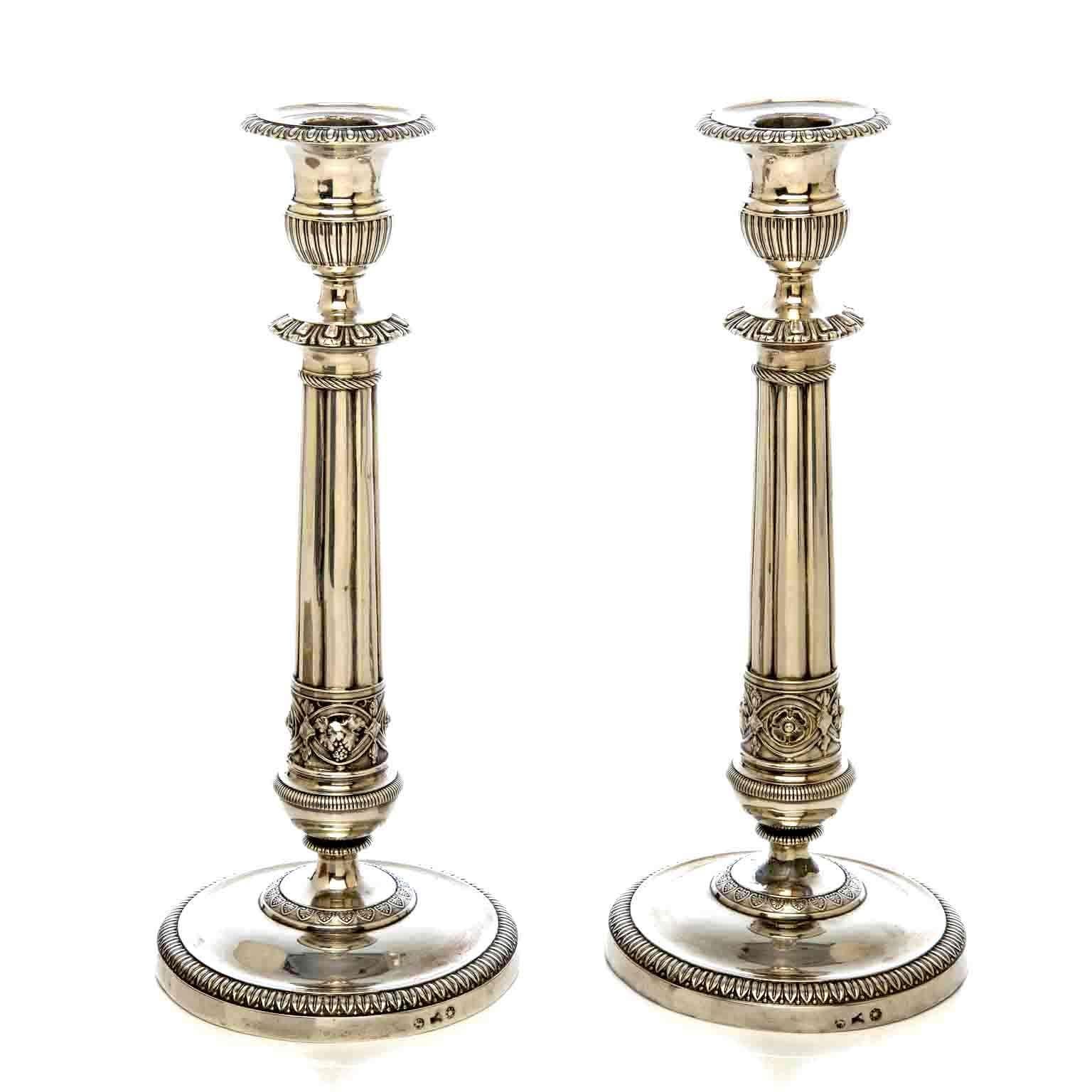 Pair of 19th century Italian Neoclassic silver candlesticks, chiseled with geometrical motifs and acanthus leaves patterns. Hallmarked Milan, 1820 by Liverti Francesco silver maker, a circular foot engraved with leafy and geometric edges.

The two