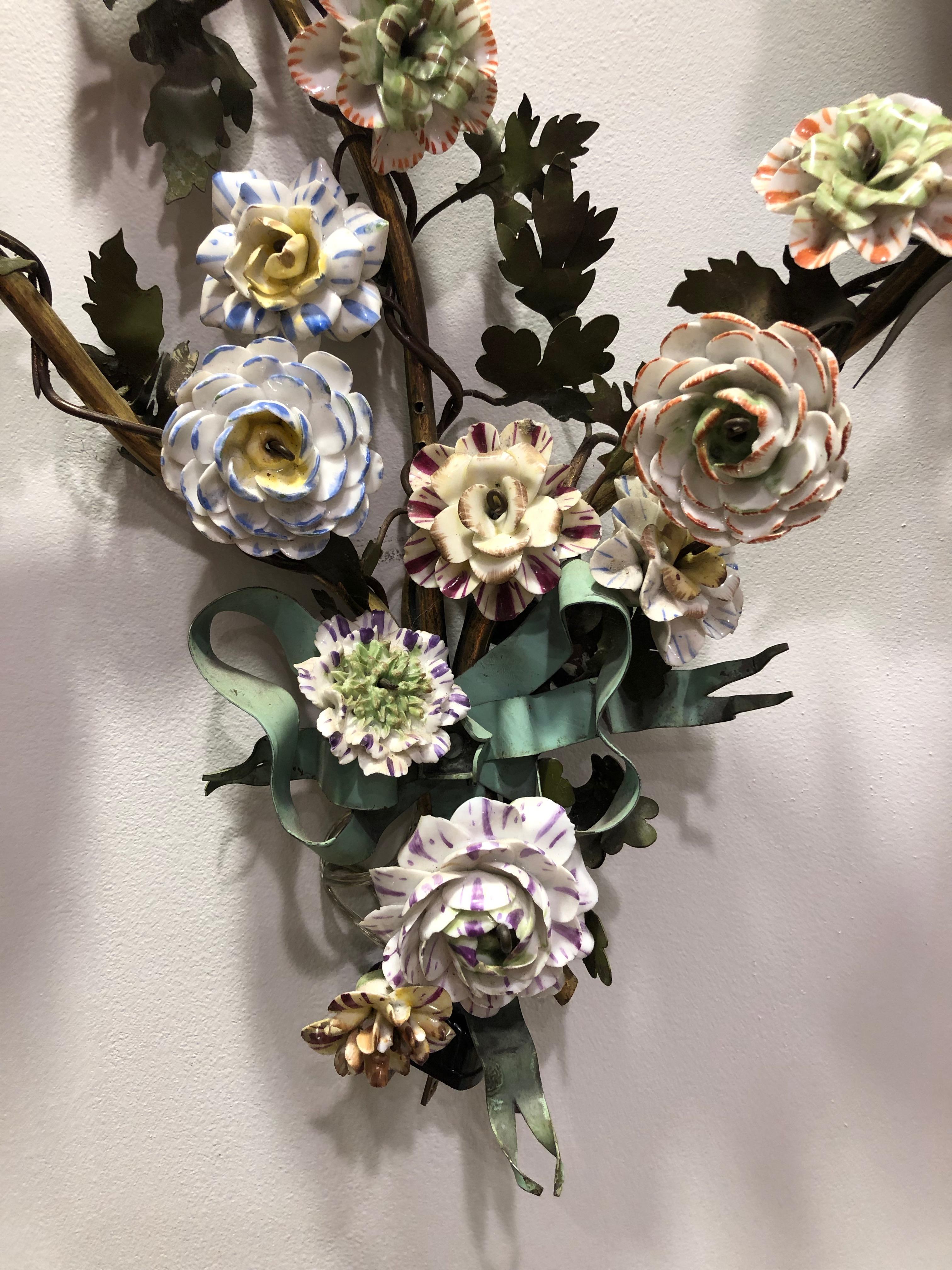 These handmade sconces have two lights each, electric with handmade porcelain flowers 19th century (re-wired later circa 1940s).