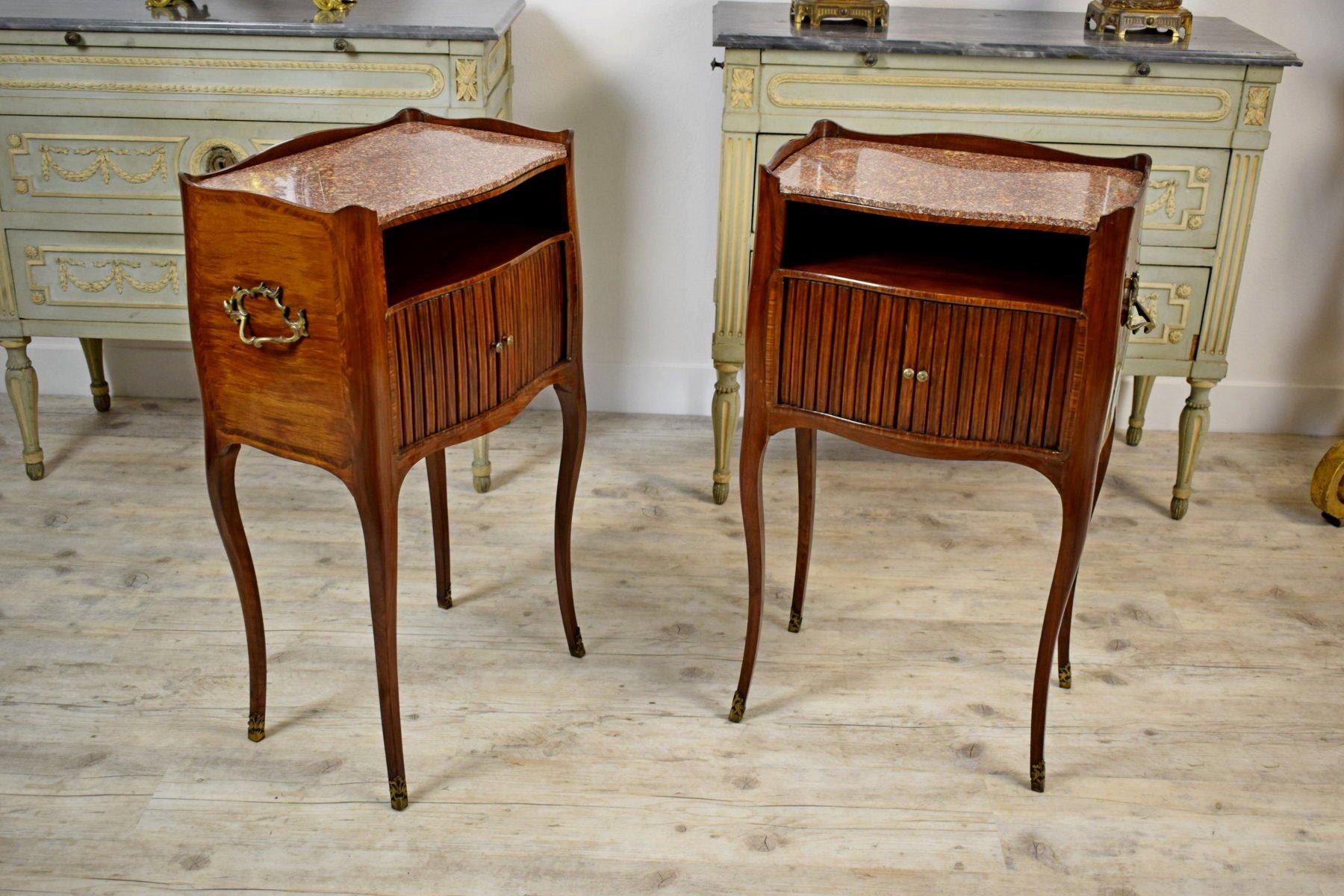 19th century, pair of Italian walnut wood bedside tables

This refined pair of bedside tables was made in Genoa, Italy, circa beginning of the 19th century.
The small walnut furniture, have a very elegant line, with thin arched legs and marble