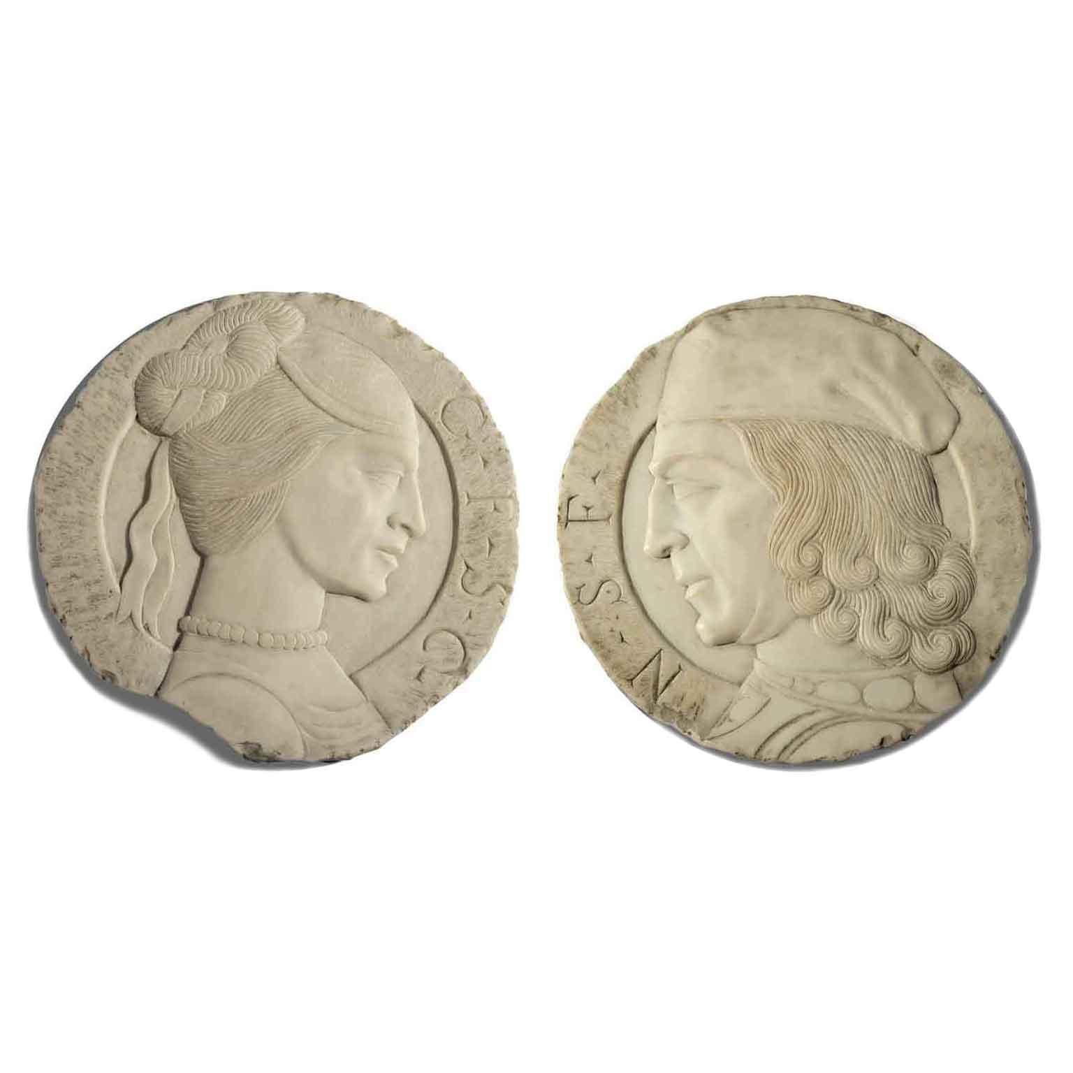 Pair of Italian Carrara marble relief plaques, a pair of Italian late 19th century marble profile portraits, depicting a Renaissance style man and a lady, a couple of court dignitaries, after the antique. The man with the hat and long curled hair is