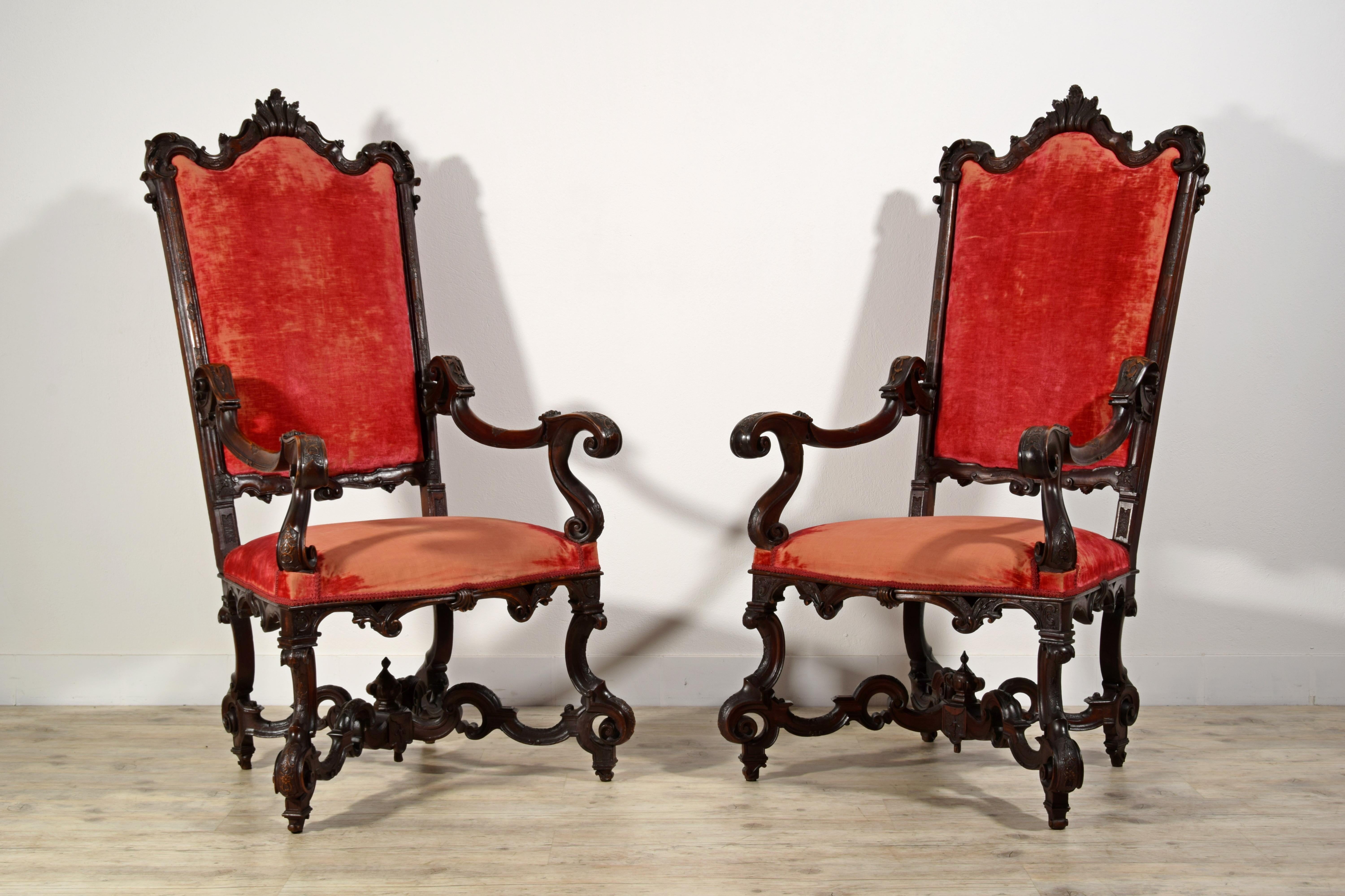 19th century pair of Italian wood armchairs

This important pair of armchairs was made in Veneto in the first 19th century, Louis XIV-Regency.
The armchairs have a remarkable quality of carving with garlands elements. The backrest ends with a mixed