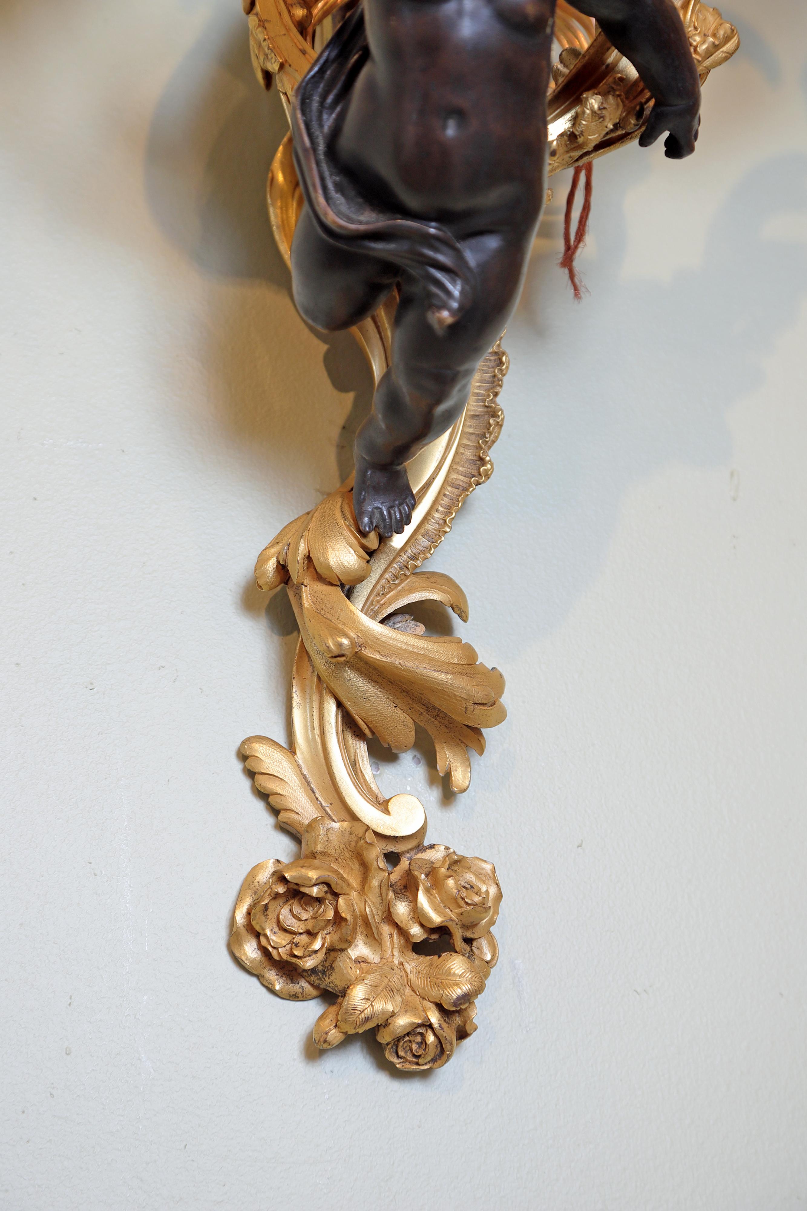 19th Century Pair of Large French Gilt Bronze and Patinated Cherub Sconces In Good Condition In Dallas, TX