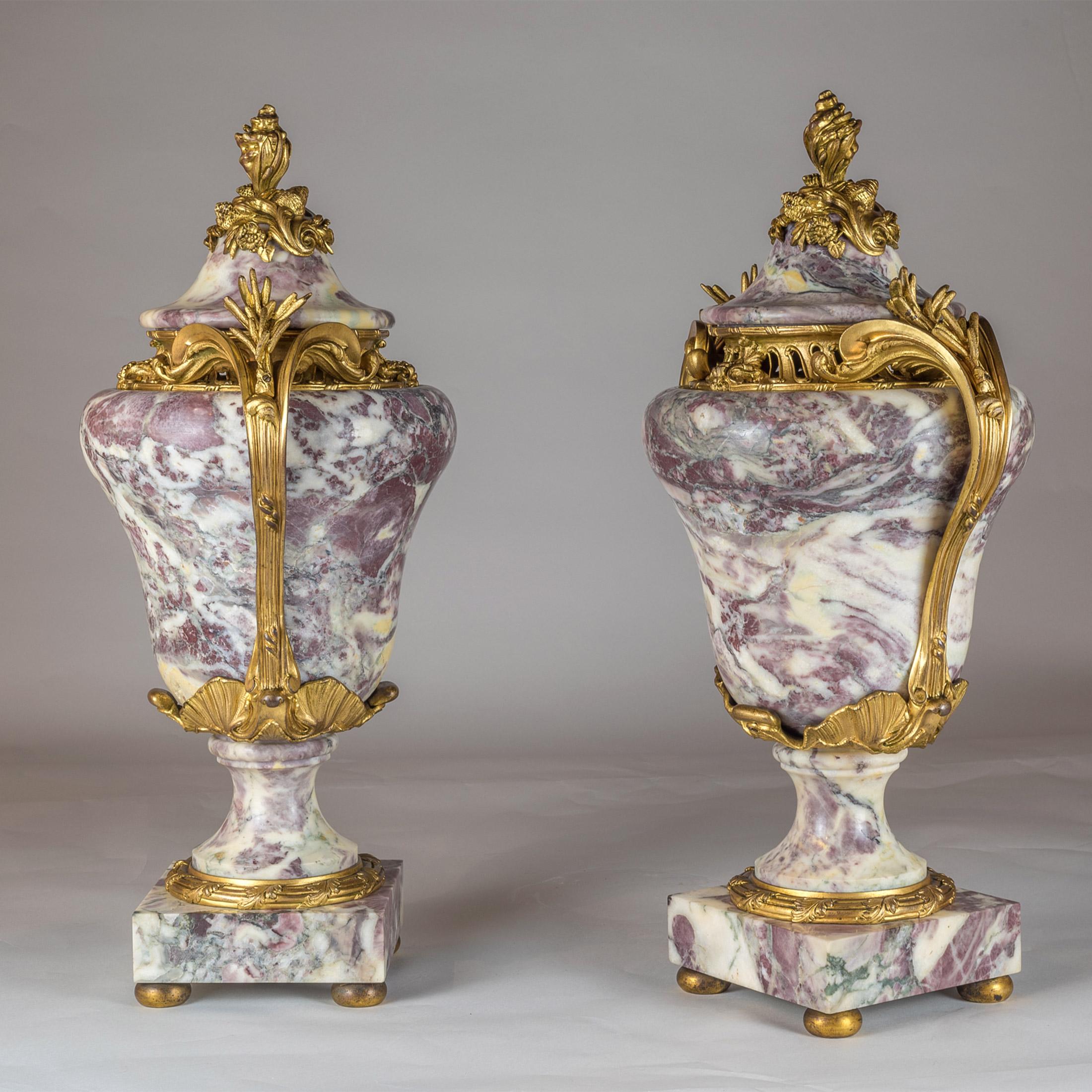 A pair of fine quality Louis XV ormolu-mounted Sarrancolin marble urn and cover.
Each with a bulbous body on a stepped plinth. 

Origin: French?
Date: 19th century?
Dimension: 23 inches high.
