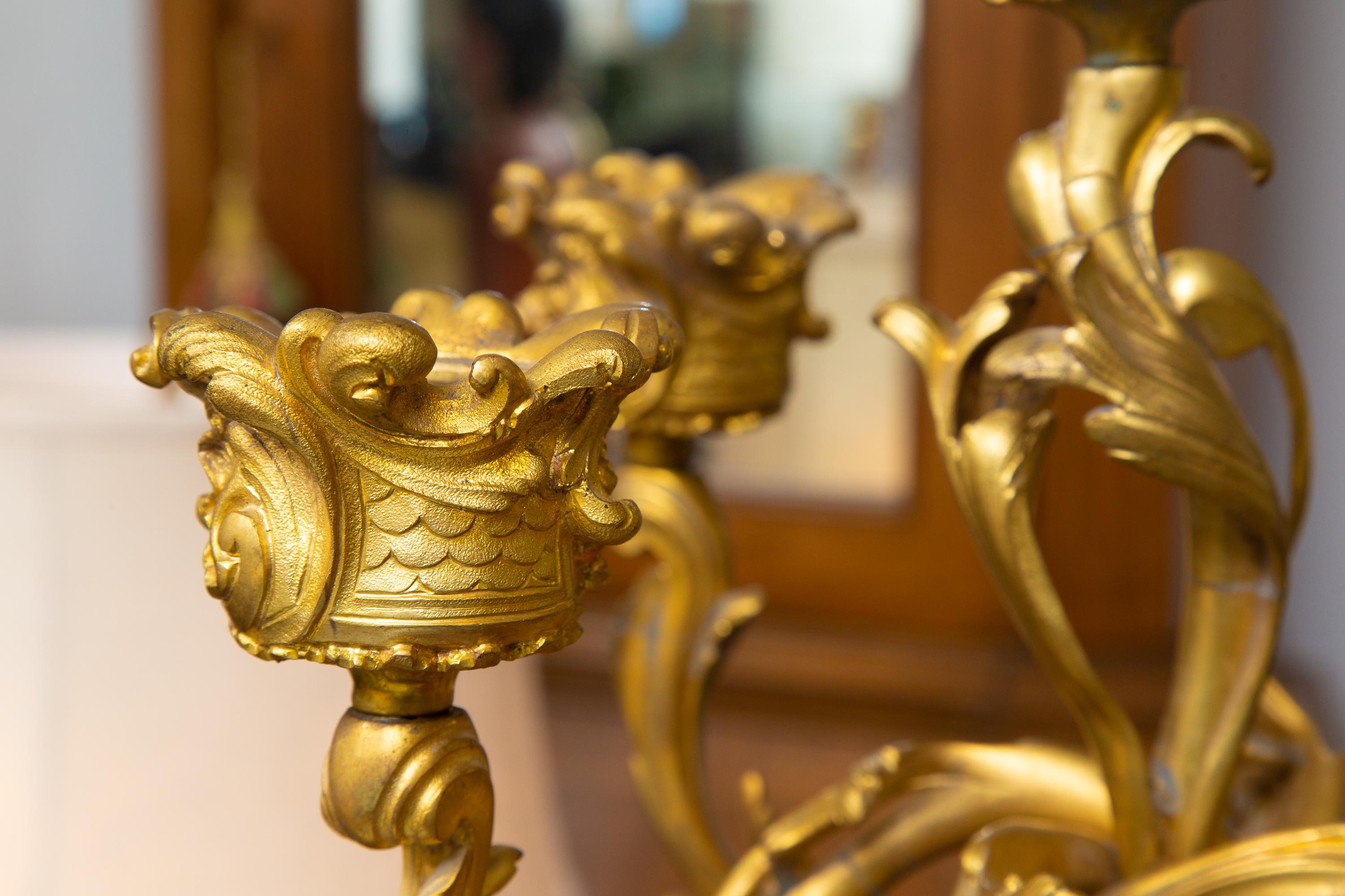 This is a very stately pair of Louis XV style gilt bronze and rouge five-light marble candelabra. 19th century.