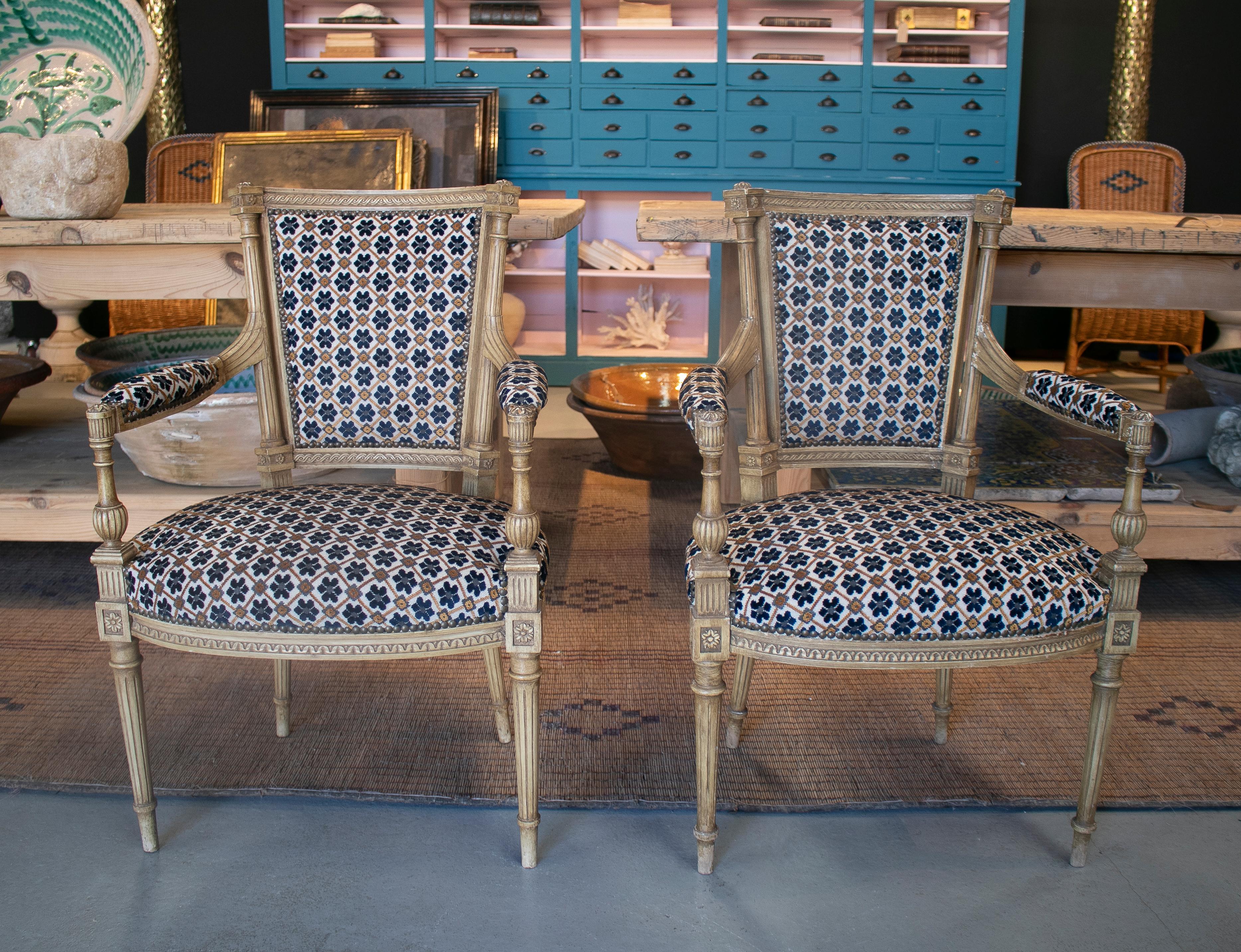 19th century pair of Louis XVI style armchairs upholstered with Lorenzo Castillo fabrics.