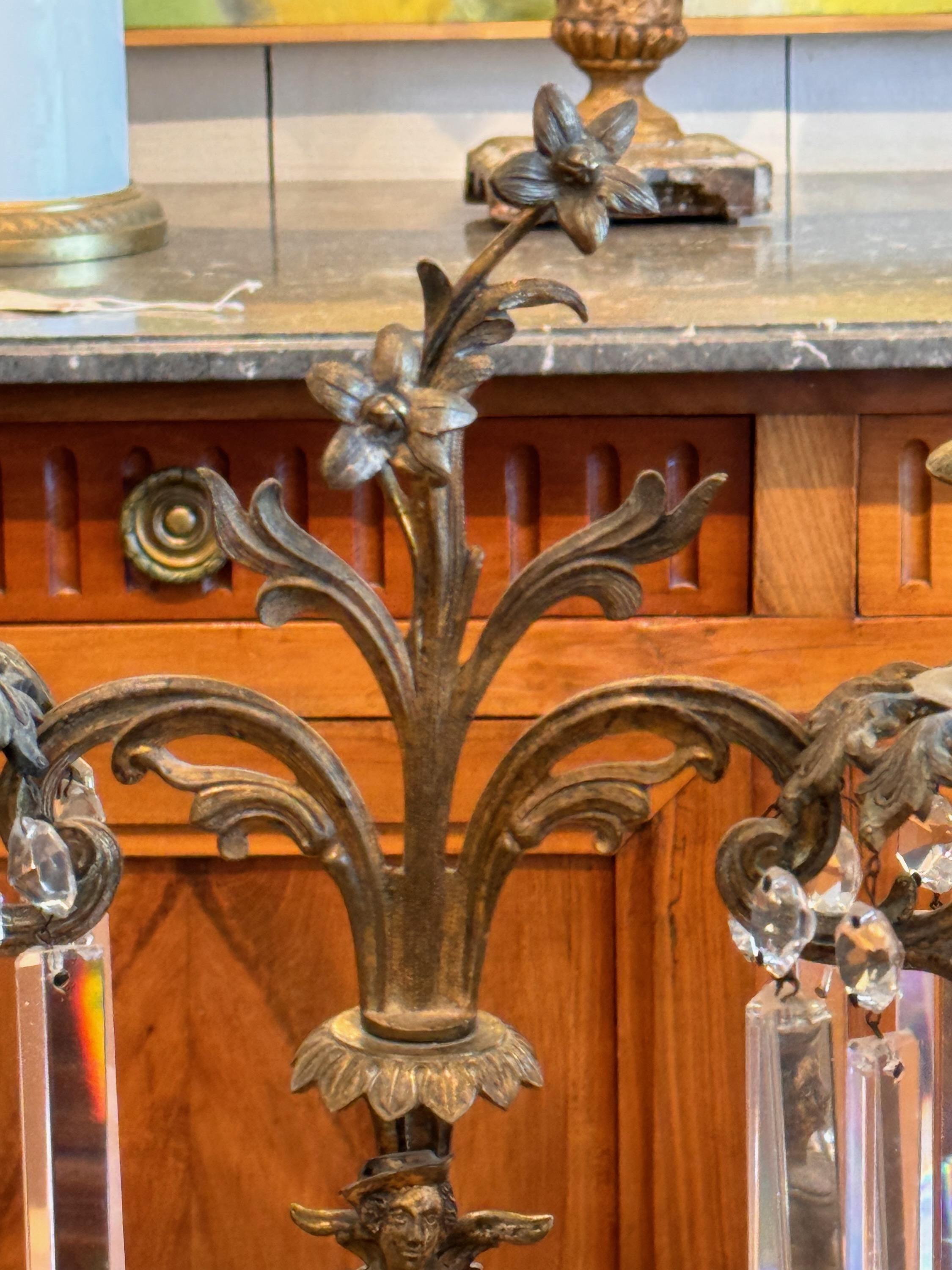 A pair of bronze and crystal candelabra. Imagine these on your mantle or sideboard.