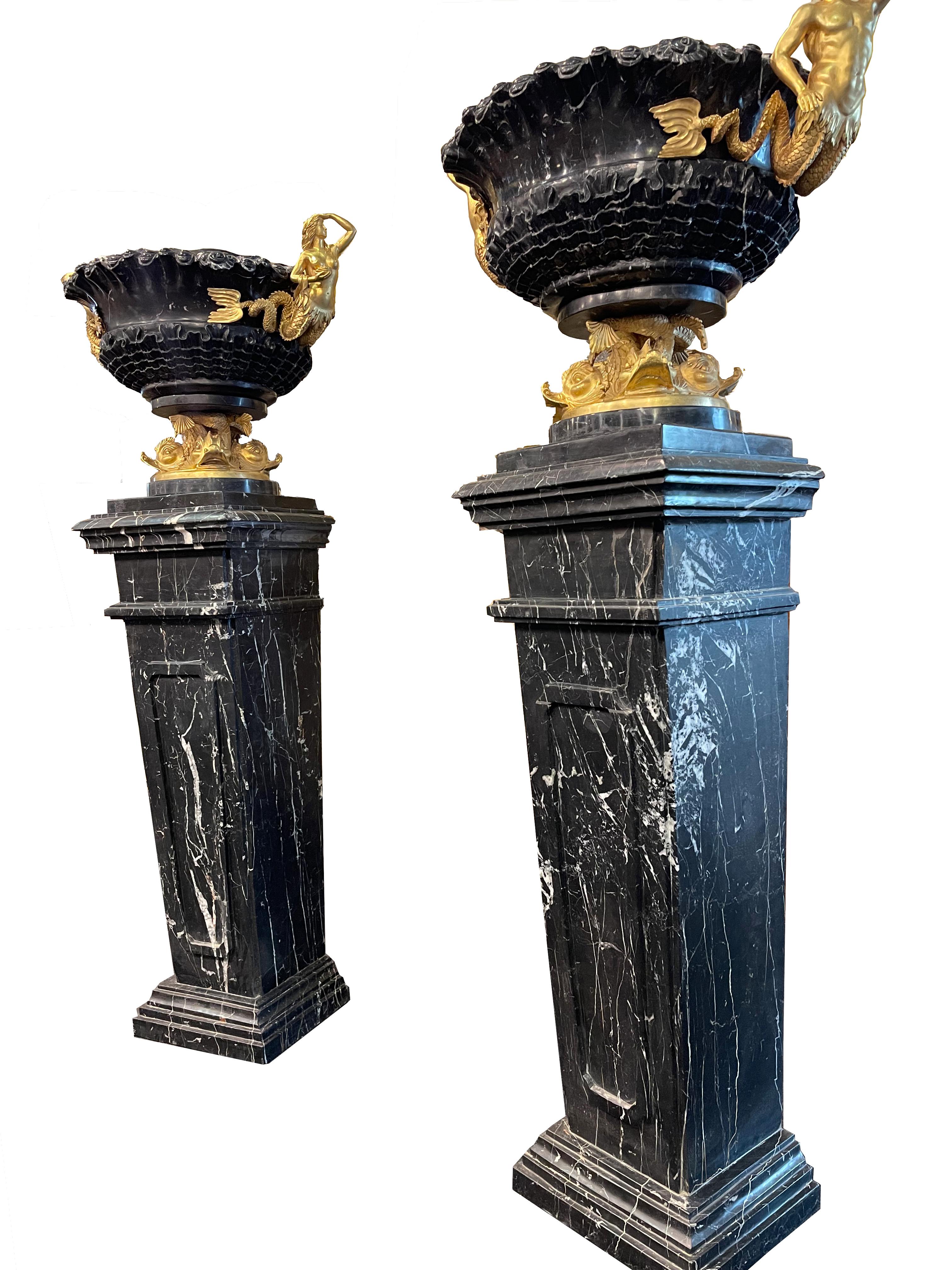 Majestic pair of vases with pedestals, in Grand Antique marble. Sculptural handles in finely chiseled and gilded bronze, bronze group depicting fish mastered in the base.
They come from an ancient residence in Palermo.
In the Manner of Pierre