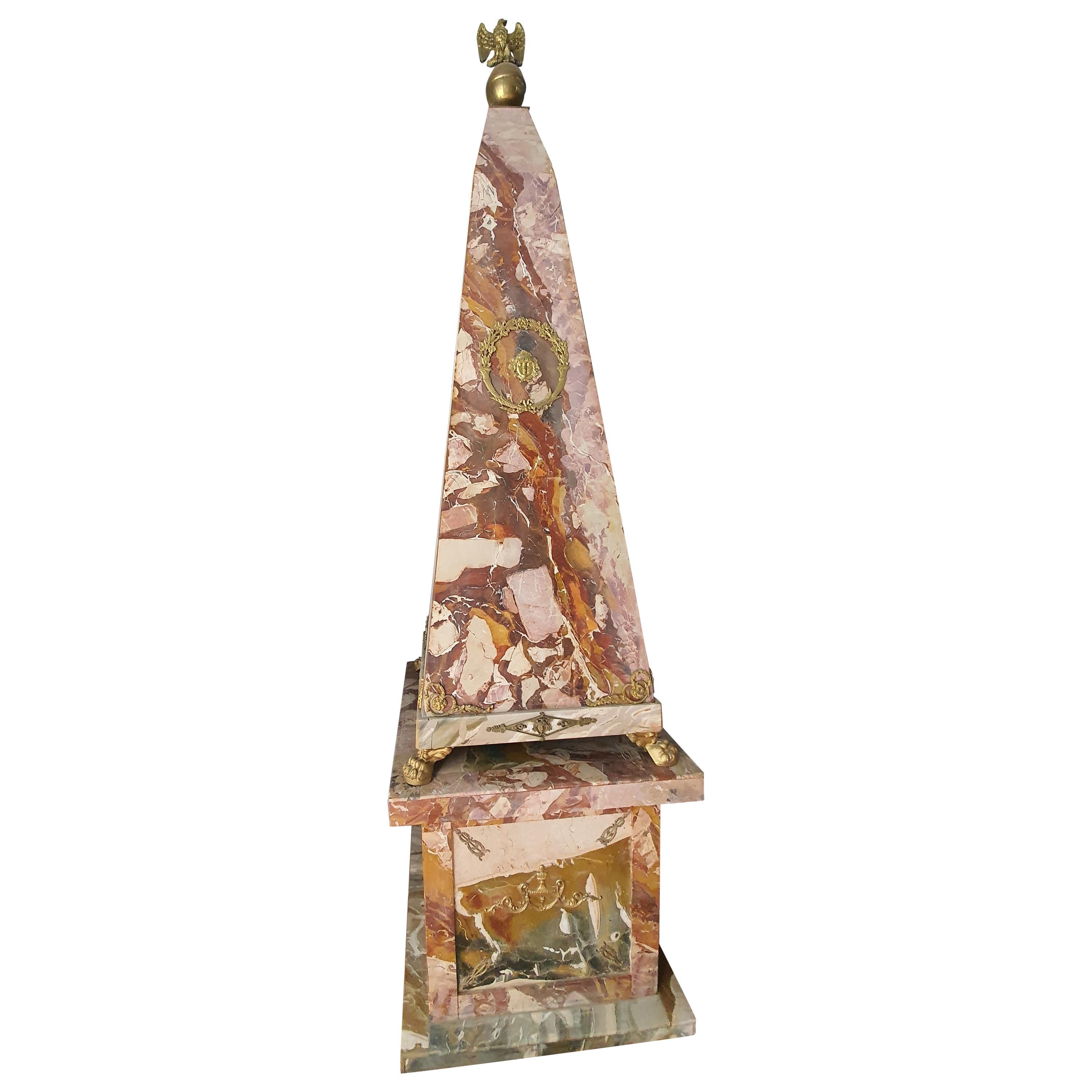 Rare pair of large obelisks entirely veneered in Sicilian open scrub jasper. Gilt bronze applications adorn the all-round obelisks. In the upper part two eagles in gilded bronze dominate.