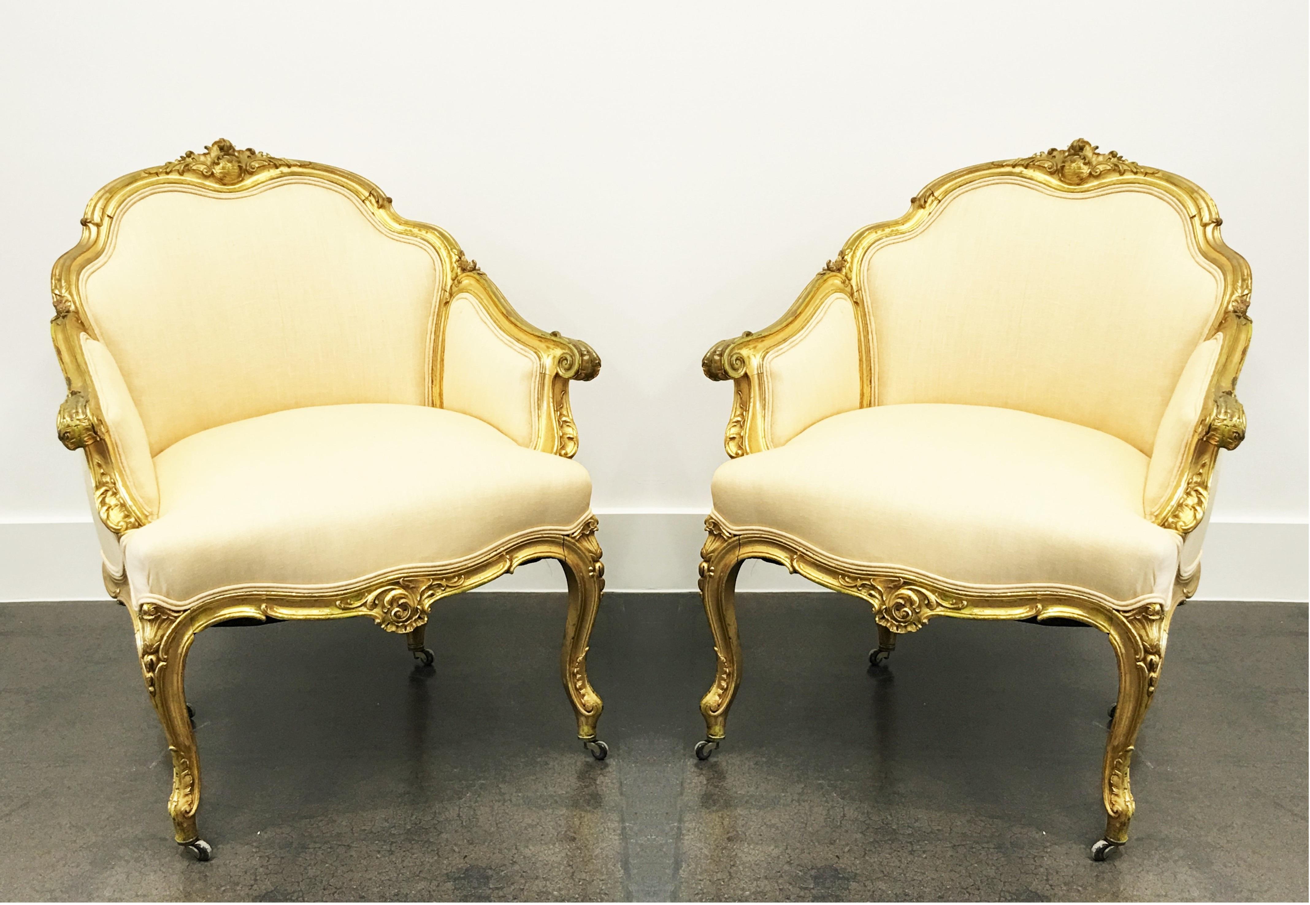 Wonderful pair of 19th century Napoleon III Louis XV bergères in the Louis XV taste. All original gilt. Featuring padded trisected back and sides surmounted by a shell and foliate crest. Centring the arbalest shaped frieze is a beautiful and richly