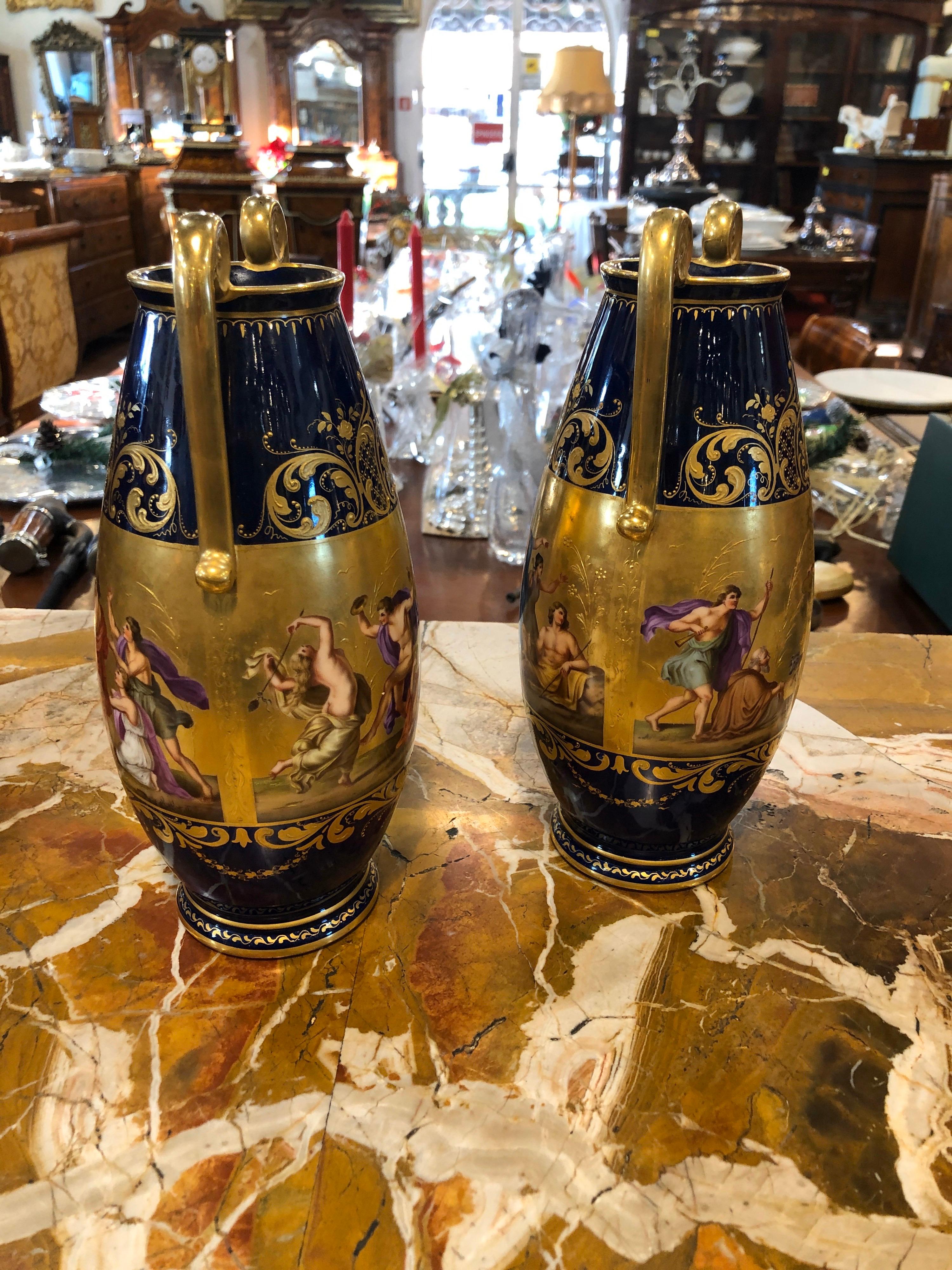 Pair of Viennese vases, in gold and blue, depicting Apollo and shepherd of arcadia. Fine workmanship in gold and well-painted figures, circa 1860.
