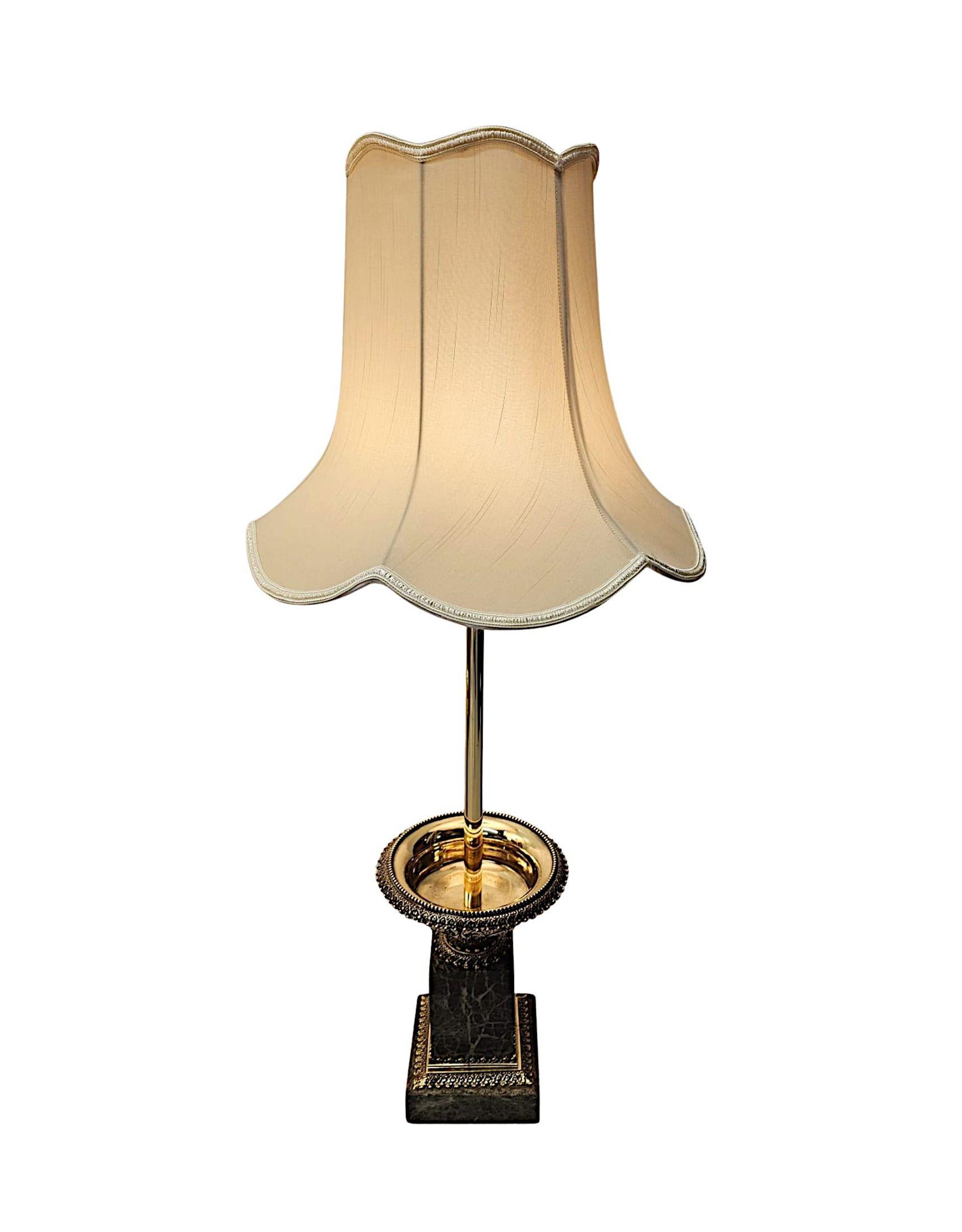 A stunning pair of 19th Century ormolu and marble tazza urns converted to table lamps.  This very fine pair of lamps are fully restored and converted to table lamps with beautiful patination and of exceptional quality.  The elegantly ring turned