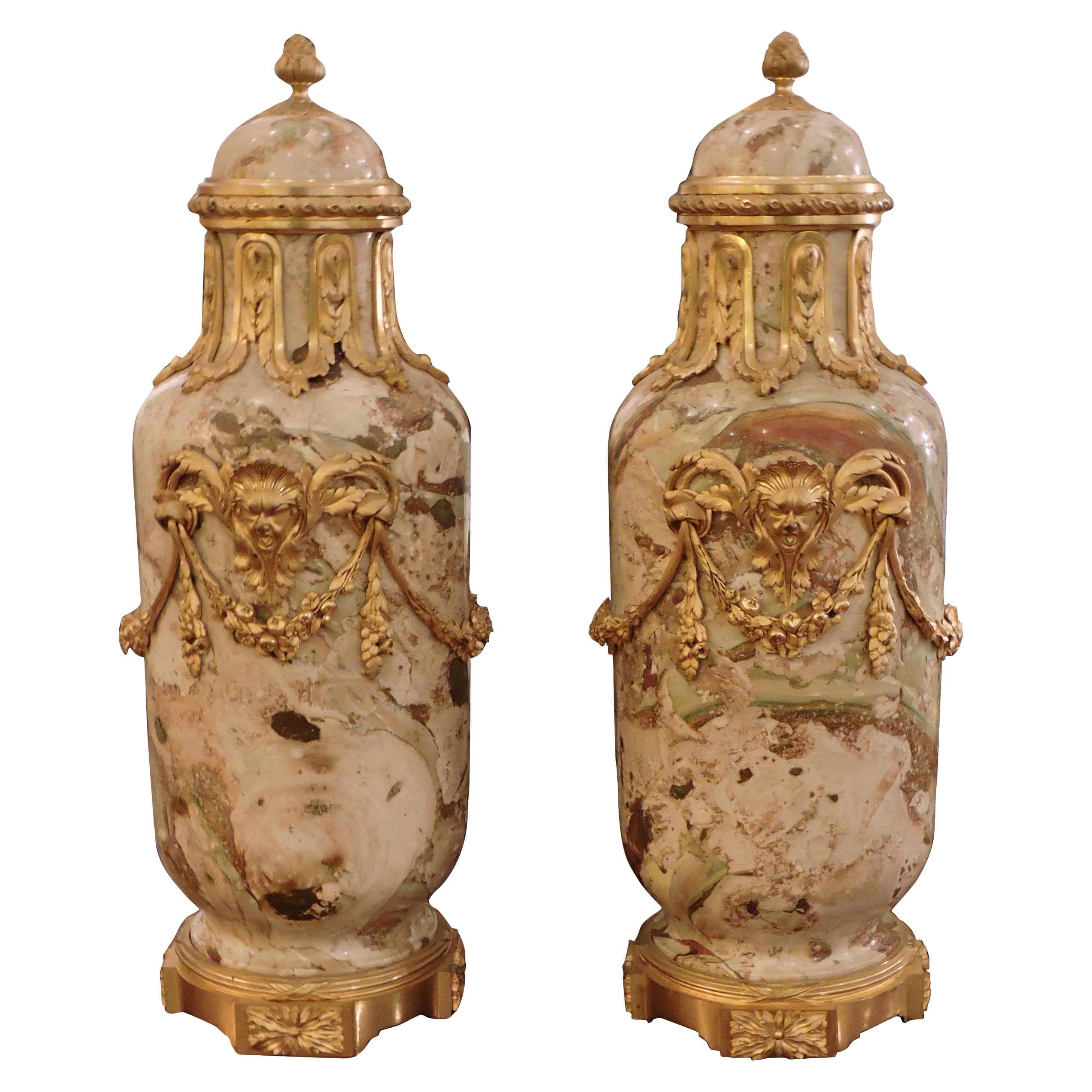 A 19th French pair of ormolu-mounted Napoleon III Louis XVI style very rare Sarrancolin marble cassolettes.
Very nicely chiselled and originally gilt design of garlands of flowers, laurels, and Minerva's heads, the covers surmounted by a