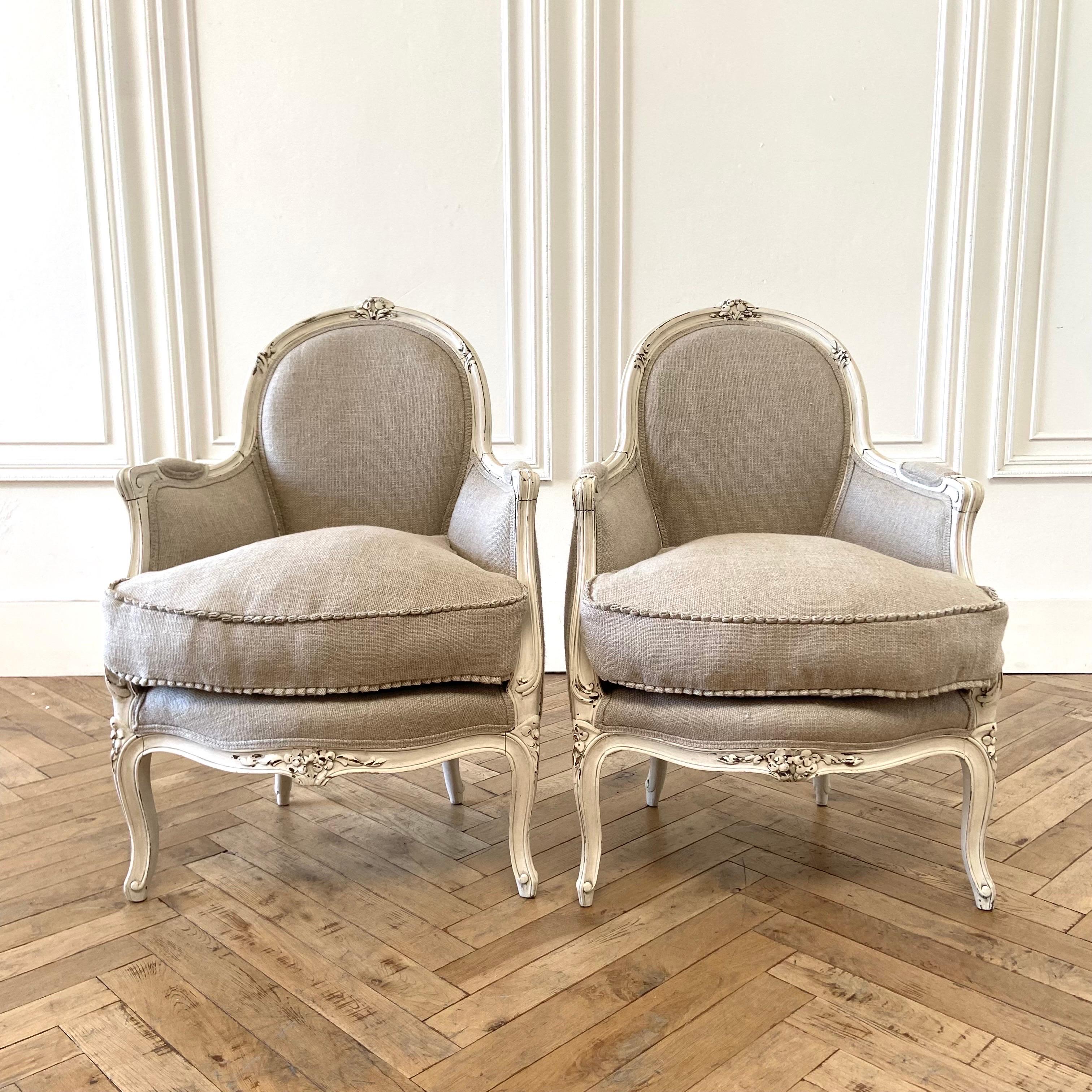 Pair of painted and upholstered 19th century French Louis XV Style bergere chairs 24” W x 24” D x 35” H
SH: 18”. SD: 18”
Painted in our custom oyster white finish with subtle distressed edges, and antique patina. New upholstery in a 100% pure