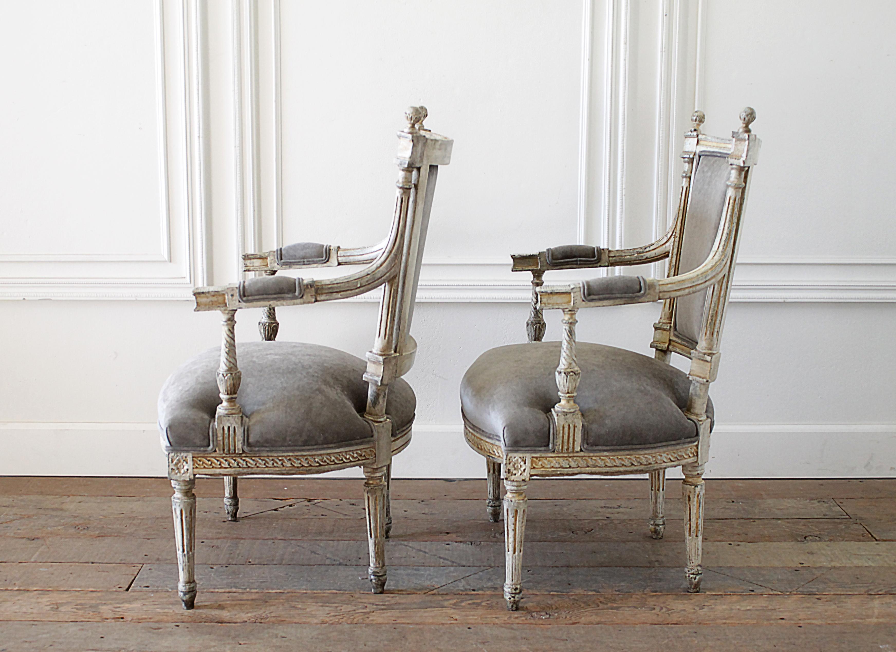 Hand-Carved 19th Century Pair of Painted and Upholstered Louis XVI Style Open Arm Fauteuils For Sale