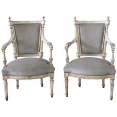 Antique 19th Century Pair of Painted and Upholstered Louis XVI Style Open Arm Fauteuils