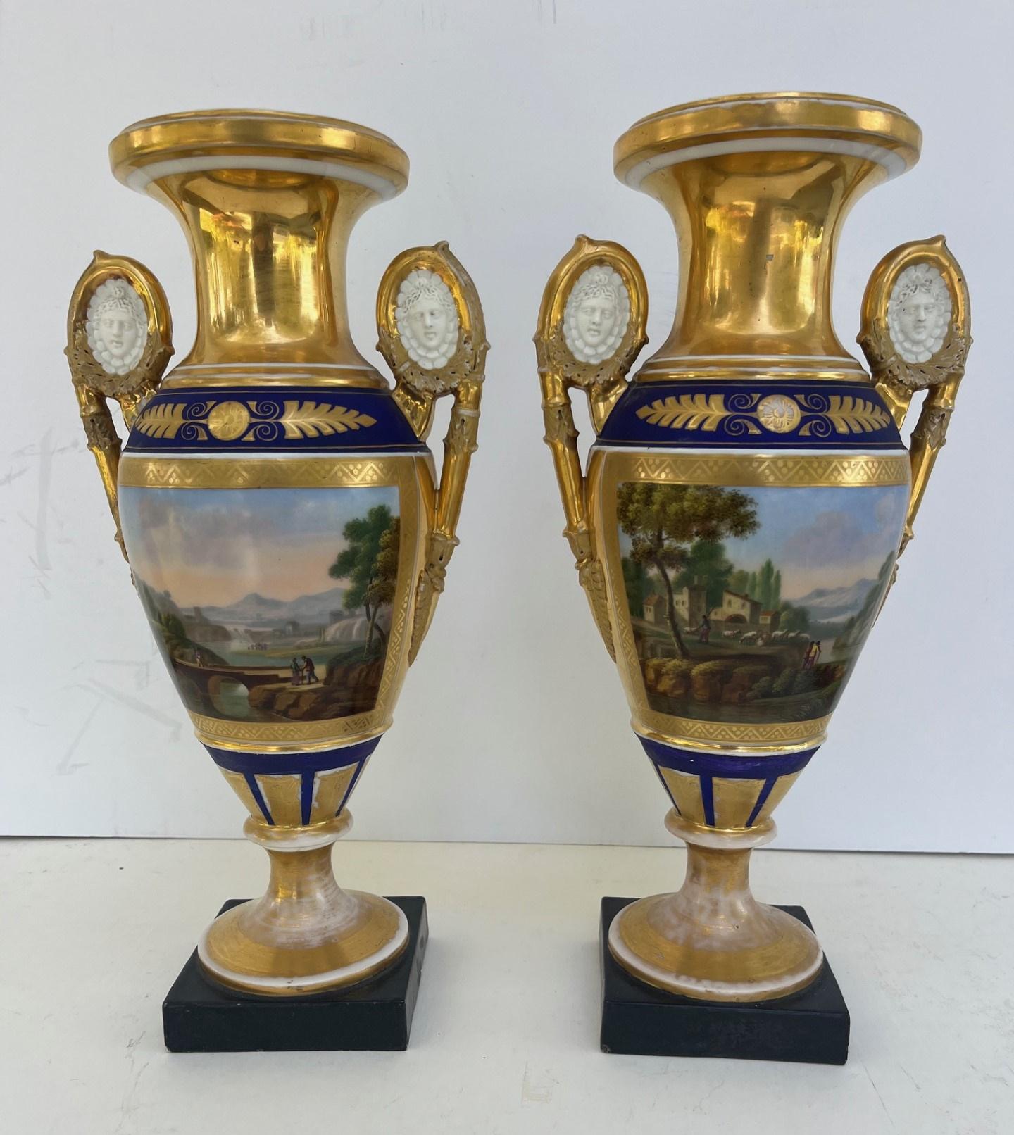 Pair of Paris Two Handled Vases in Gold and Cobalt Blue.

Pair of early 19th century Paris baluster shaped porcelain vases. Elaborately painted on each side with the most intricate polychrome and gilded decorations. The exceptional execution of the