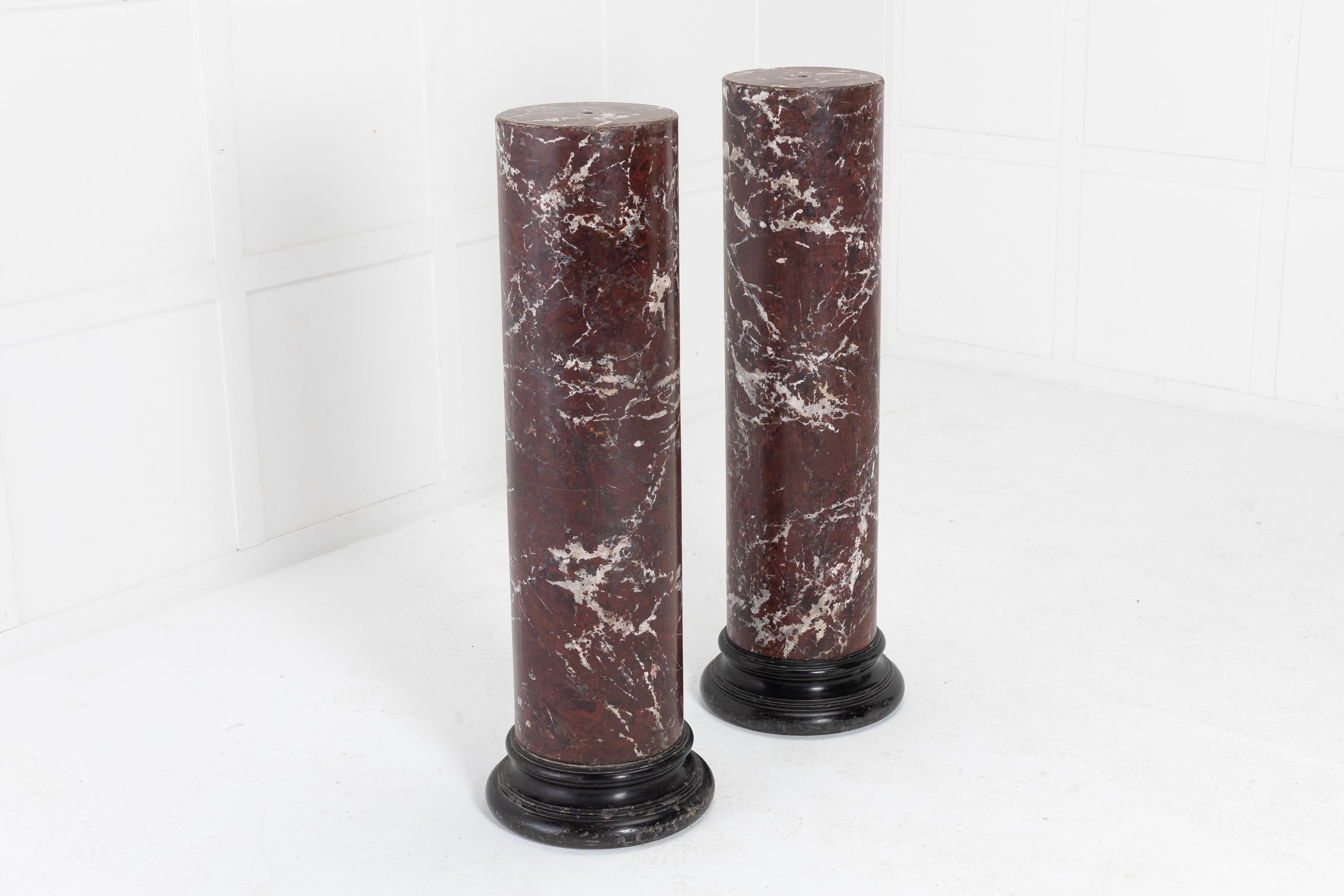 A fine pair of 19th century Regency Scagliola (marble) columns, or pedestals, having a lovely simple form with black, shaped plinths.
 