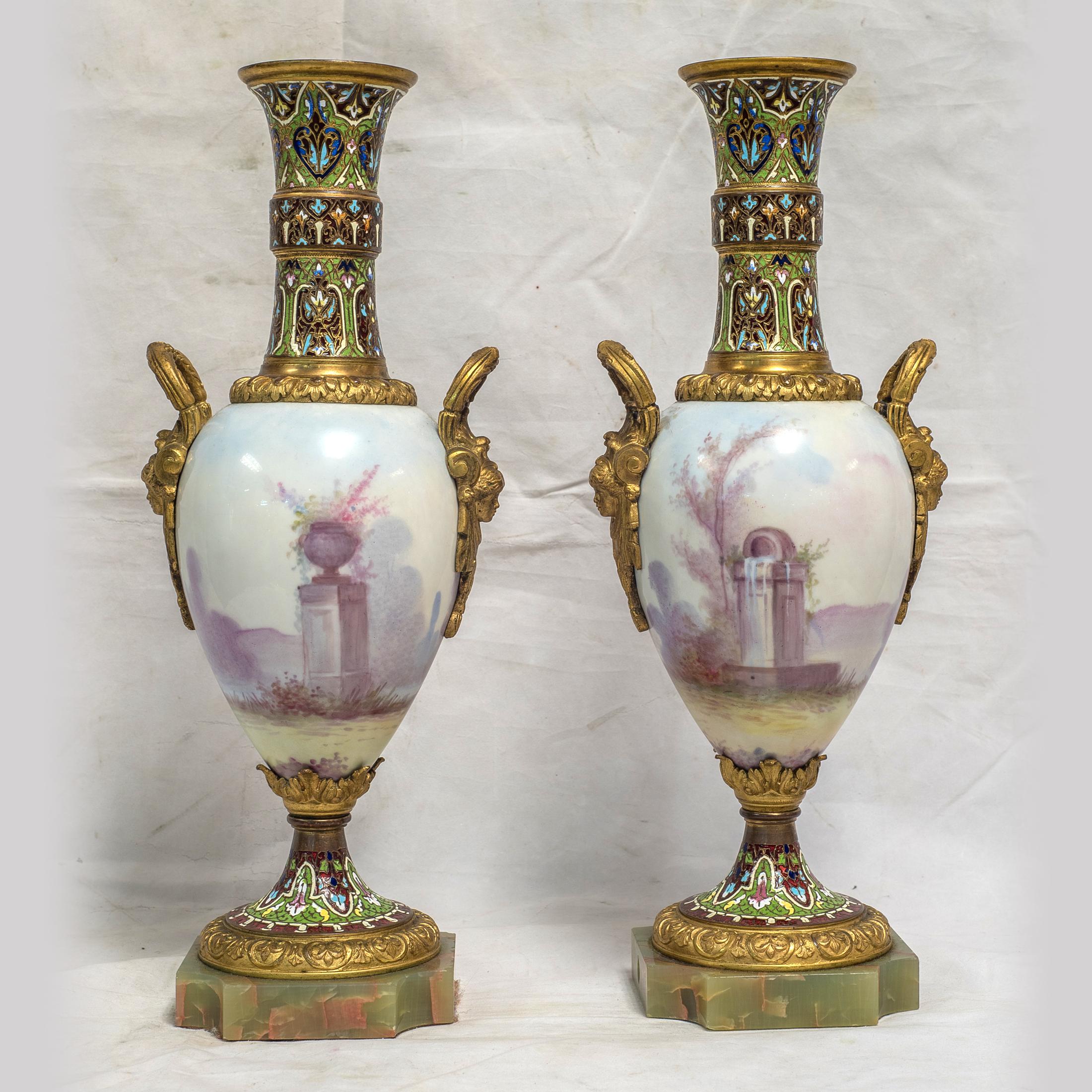 A stunning pair of Sevres-style porcelain vases with bronze and champlevé enamel mounts. Signed P. Raul

Date: 19th century
Origin: French
Dimension: 14 1/4 in x 5 3/4 in.
  