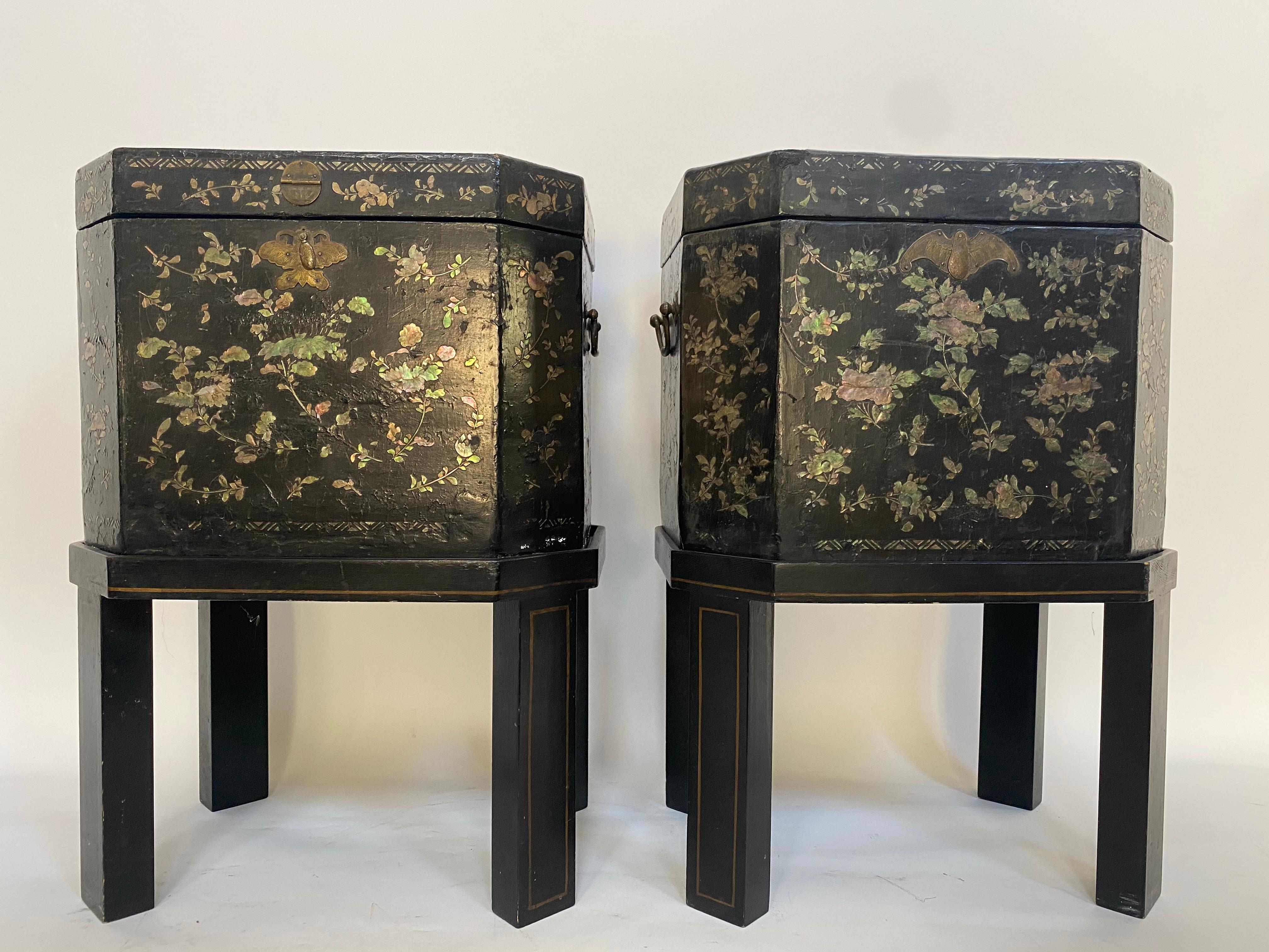 19th century unique pair of shell Inlaid black lacquer big Chinese tea caddies with Bail handles two sides ,each with hinged lid reversing to a mother-of-pearl inlaid decoration and enclosing a fitted pewter canister with double lid, set on a stand,