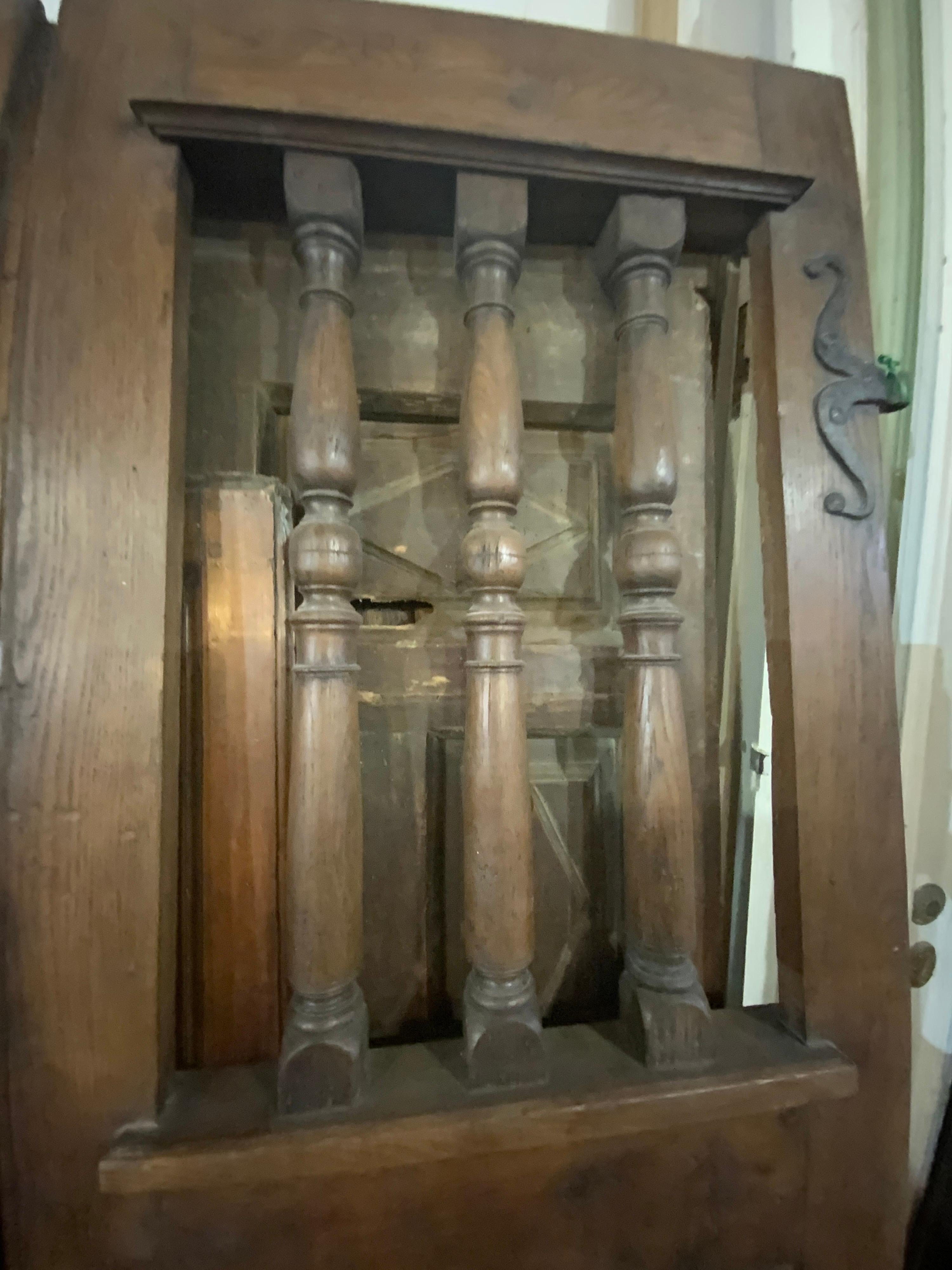 These beautiful walnut doors date back to the 1870s. Origin; Spain. These items are sold as a set.