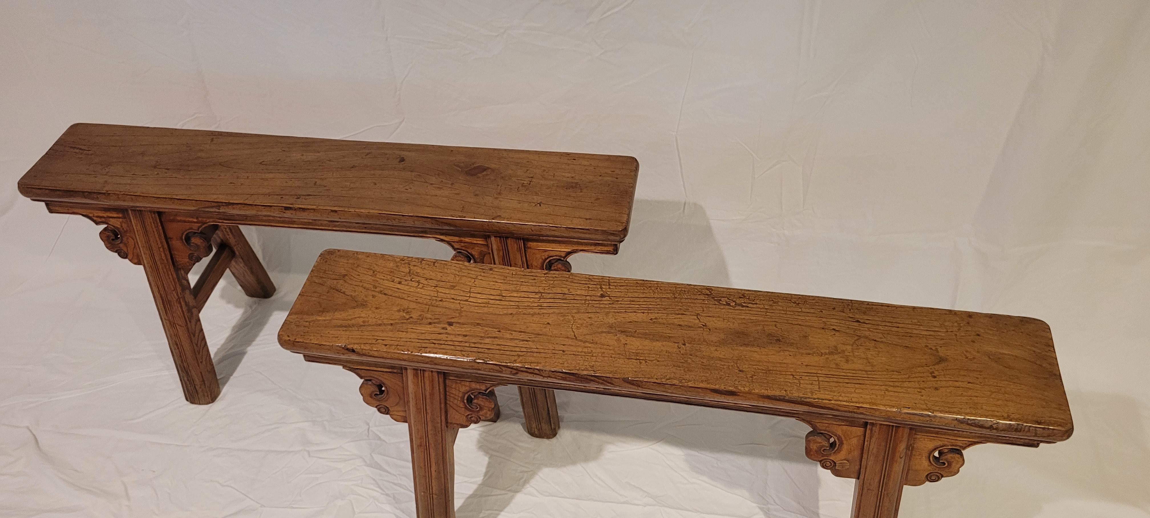 Spring Benches (Pair)	20h x 41w x 13d (lowest part of the legs)
The top of the pair is a solid plank of wood.  The legs are beaded in the style of “incense stick” and are jointed to the top panel by using unmitered tenoned joints. The spandrels are