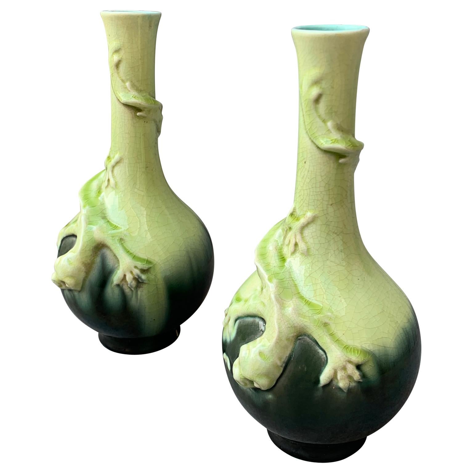 A pair of 19th Century Swedish Liberty Style Vases. Rörstrand porcelain factory in Sweden began producing in the 18th Century. This pair of Scandinavian majolica porcelain flower vases are decorated with a lizard hunting an insect molded all around