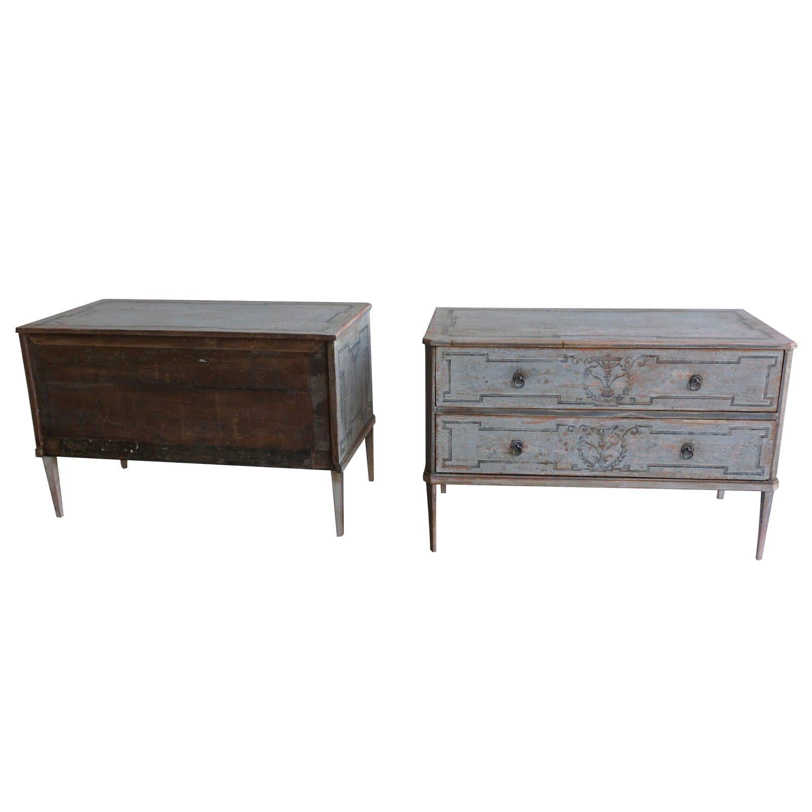 A pair of late 19th century of detailed Swedish neoclassical chests of drawers, grey-blue hand painted, two drawers with brass ring fittings tapering square legs. Wear consistent with age and use, circa 1880 Sweden, Scandinavian.