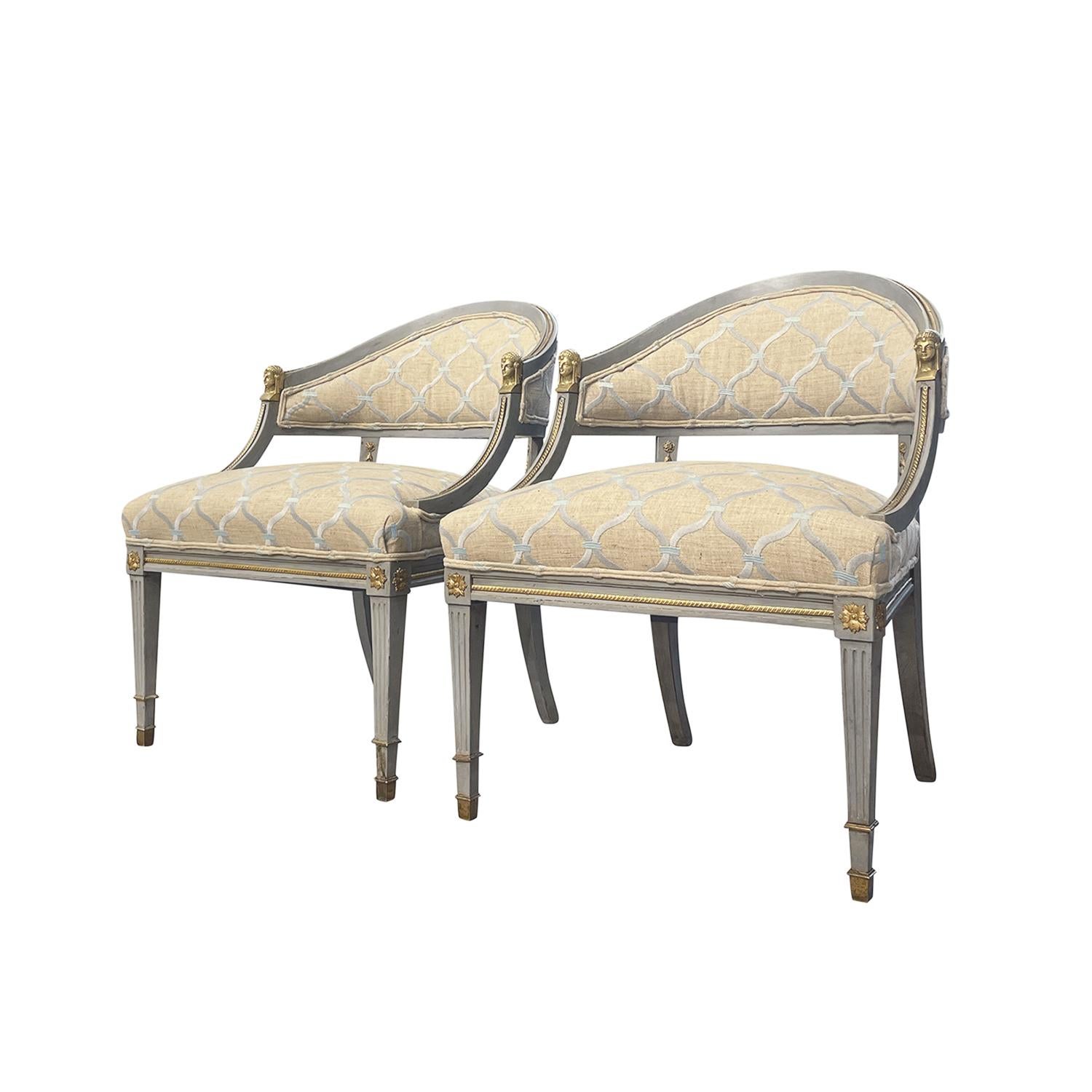 An antique pair of Swedish Gustavian armchairs made of hand crafted painted Birchwood, designed and produced most likely by Ephraim Ståhl in good condition. The Scandinavian side chairs have an half-rounded padded backrest, decorated with slim