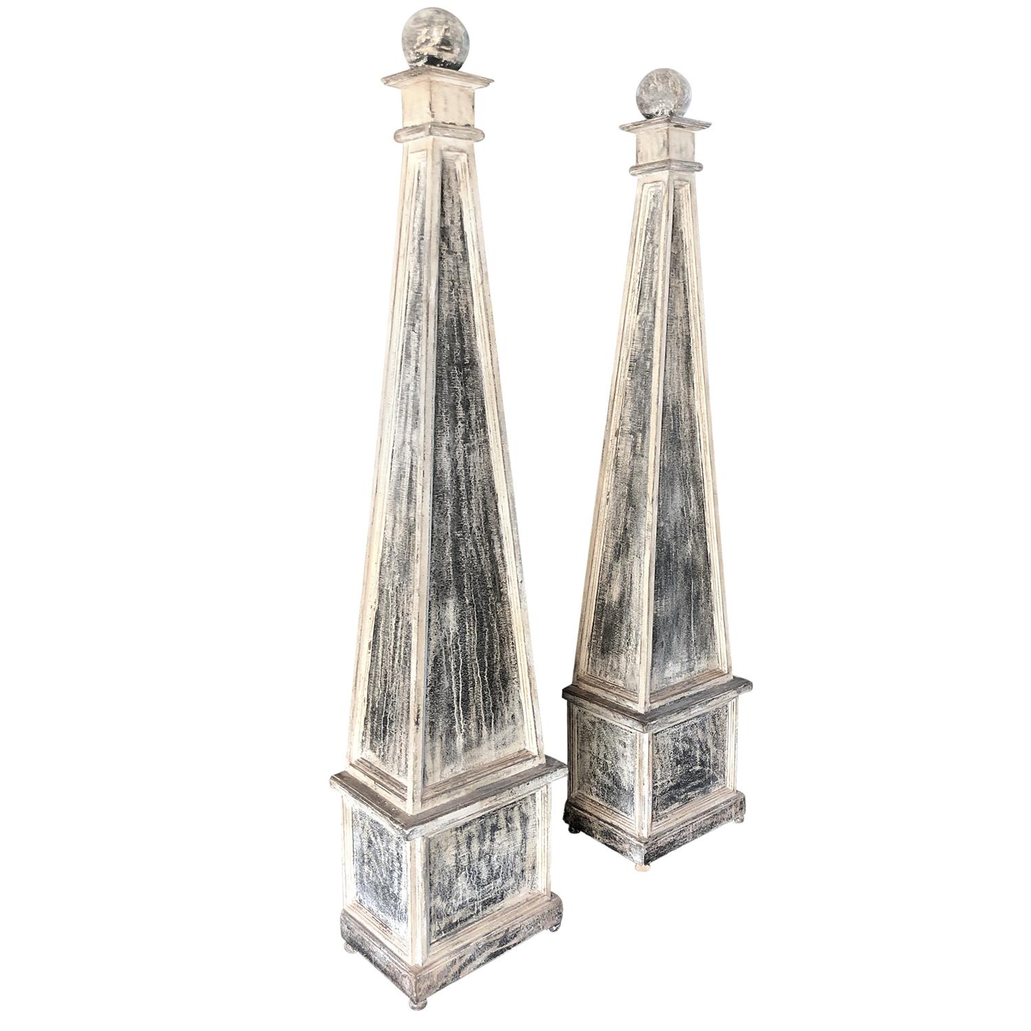 An antique pair of decorative Swedish Gustavian obelisks made of hand carved, grey pinewood and black scraped patina, in good condition. Wear consistent with age and use, circa 1880, Stockholm, Sweden, Scandinavia.