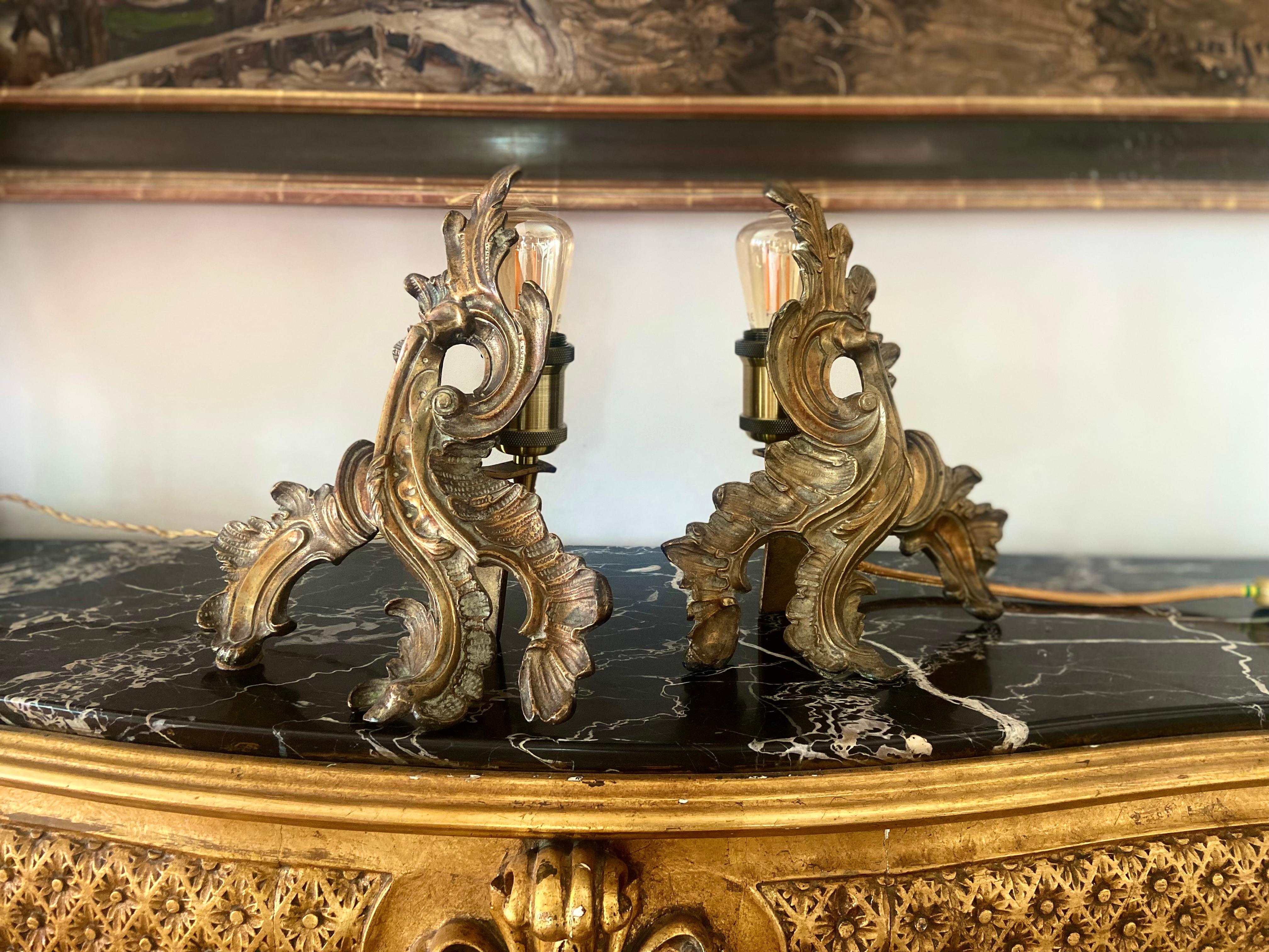 Pair of 19th century French table lamps in Louis XVI style made of bronze fireplace fire dogs that were lately electrified.
France, circa 1880.
 