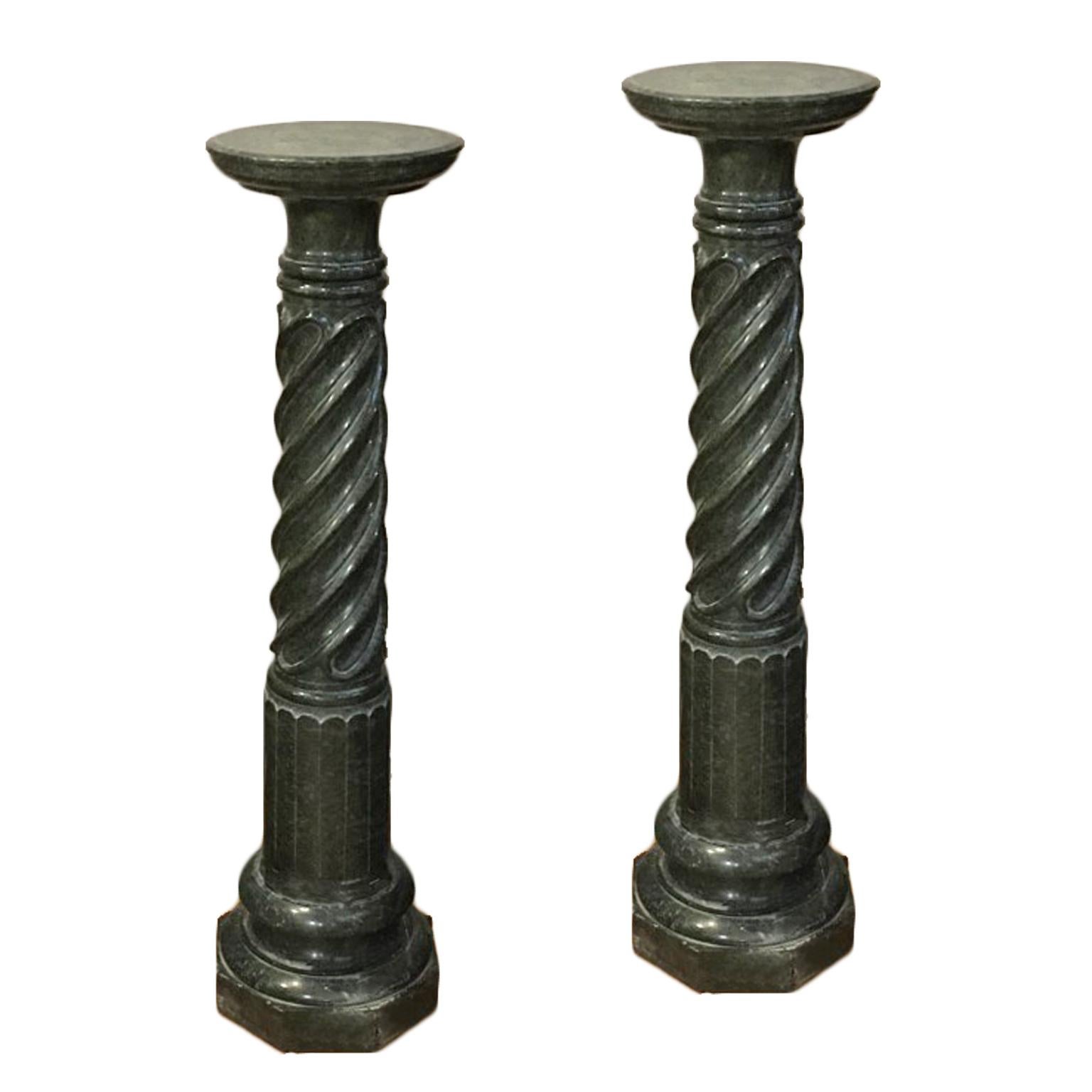 Beautiful pair of columns in green Prato marble, made in the 19th century, which recall the Renaissance style. The columns are characterized by elegant grooves in the lower part, while they are twisted in the upper part. Both decorations give a