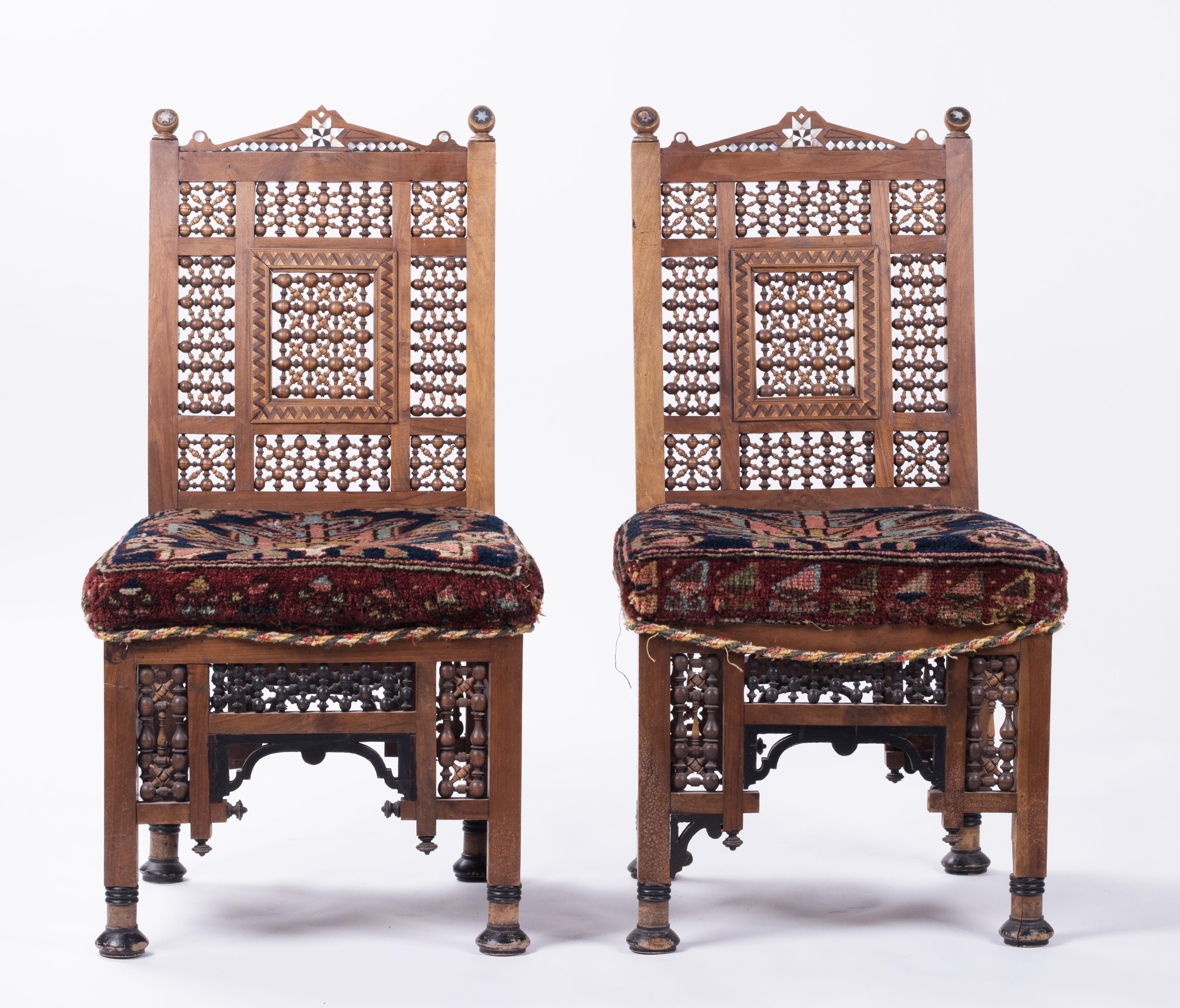 19th century pair of Turkish richly decorated hand carved wooden chairs.