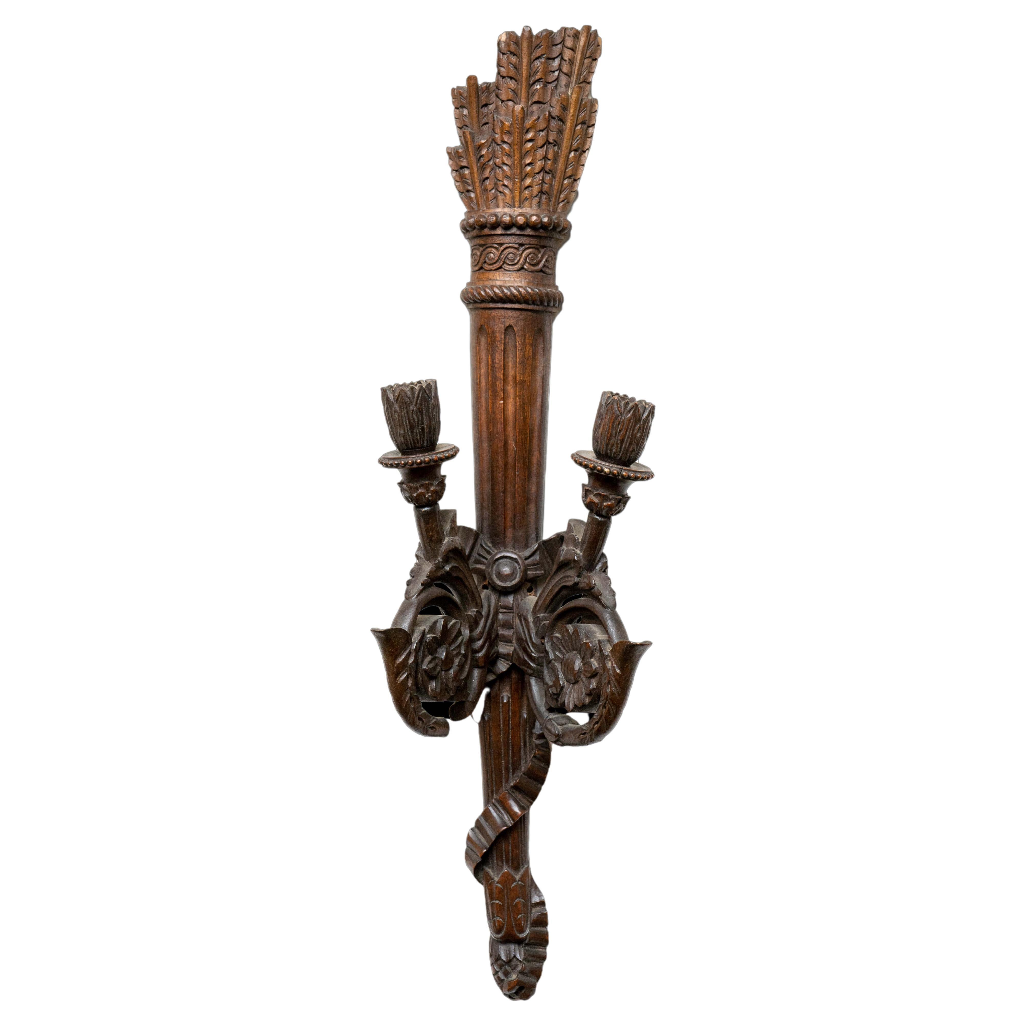 19th century pair of two arm carved wood quiver sconces with carved arrows. Can be electrified or used with candles.

Measures: 6