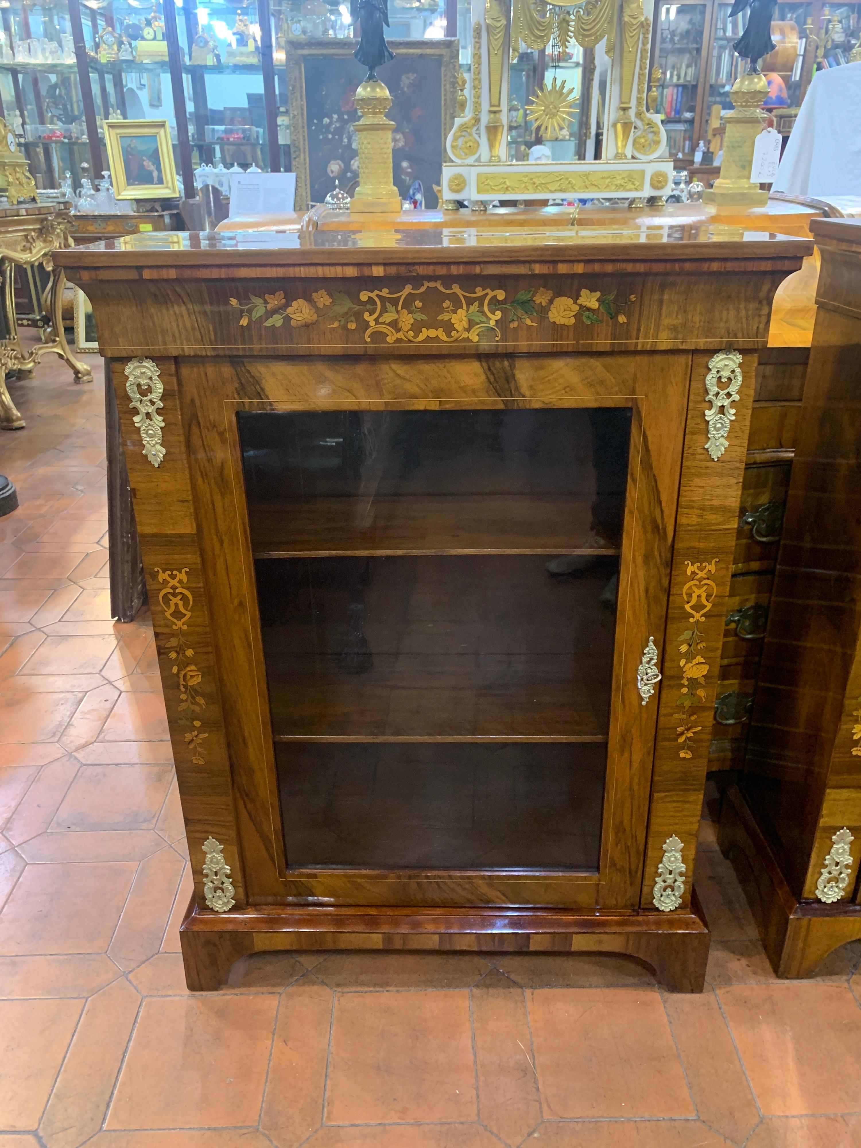Fantastic pair of pier cabinet, England 19th century, Victorian period. Finely inlaid with floral motifs in fruitwood, decorated with gilded ormolu mounts. Restored in spirit and shellac. Furniture easy to fit into any furnishing context.
This pair